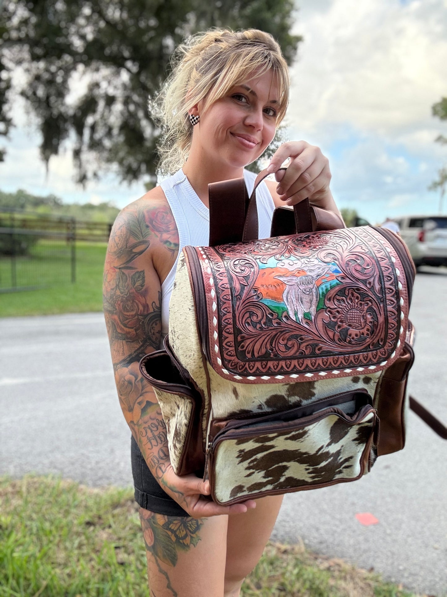 Tooled leather cow bookbag