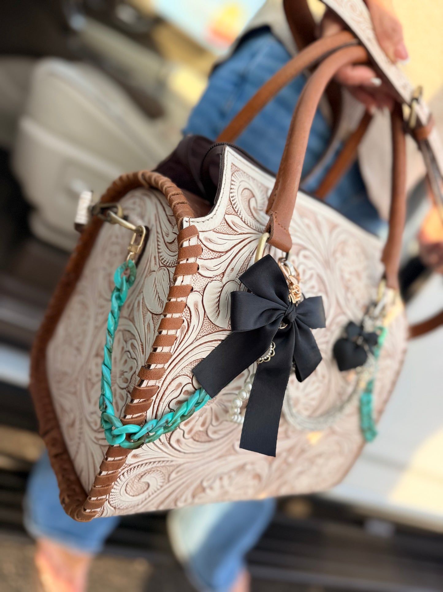 "Outlaw Heiress" - white tooled speedy (L) tote, teal/black accents