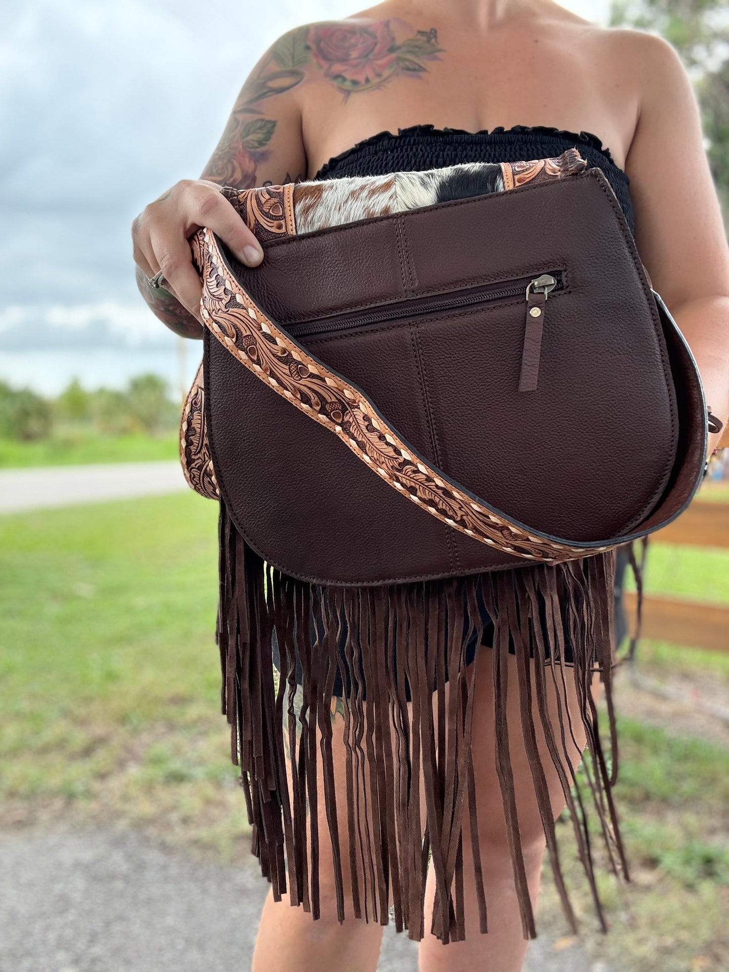 Tooled leather and cowhide purse