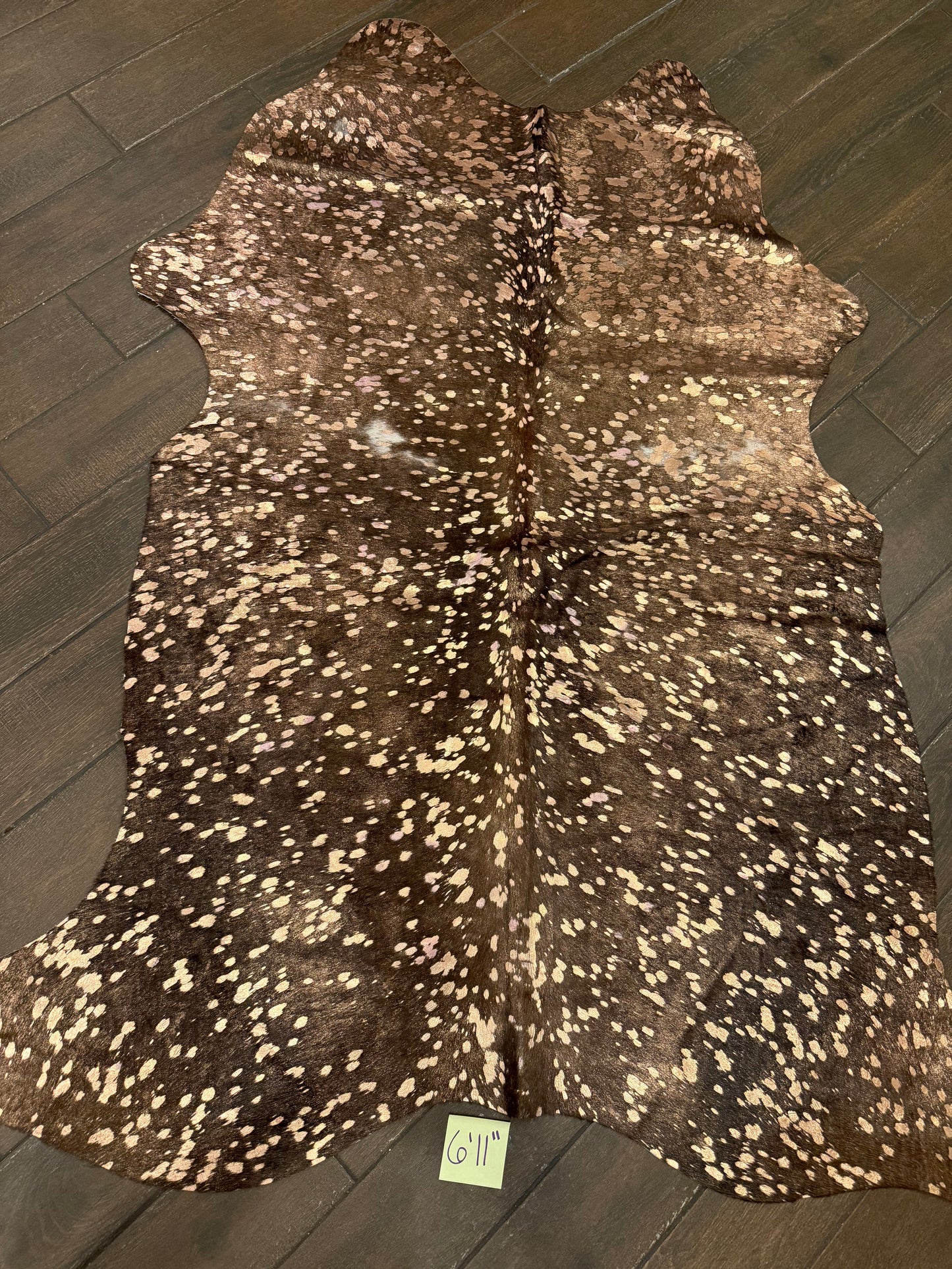 6’11” rose gold cowhide acid wash rug