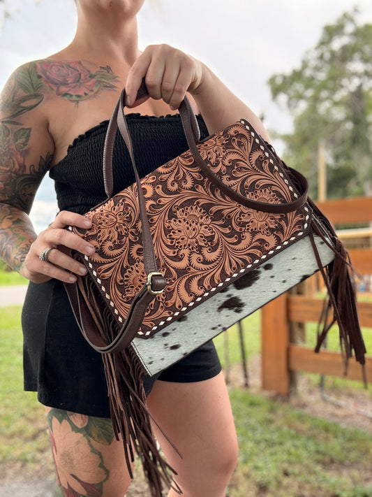 Tooled leather and cowhide purse