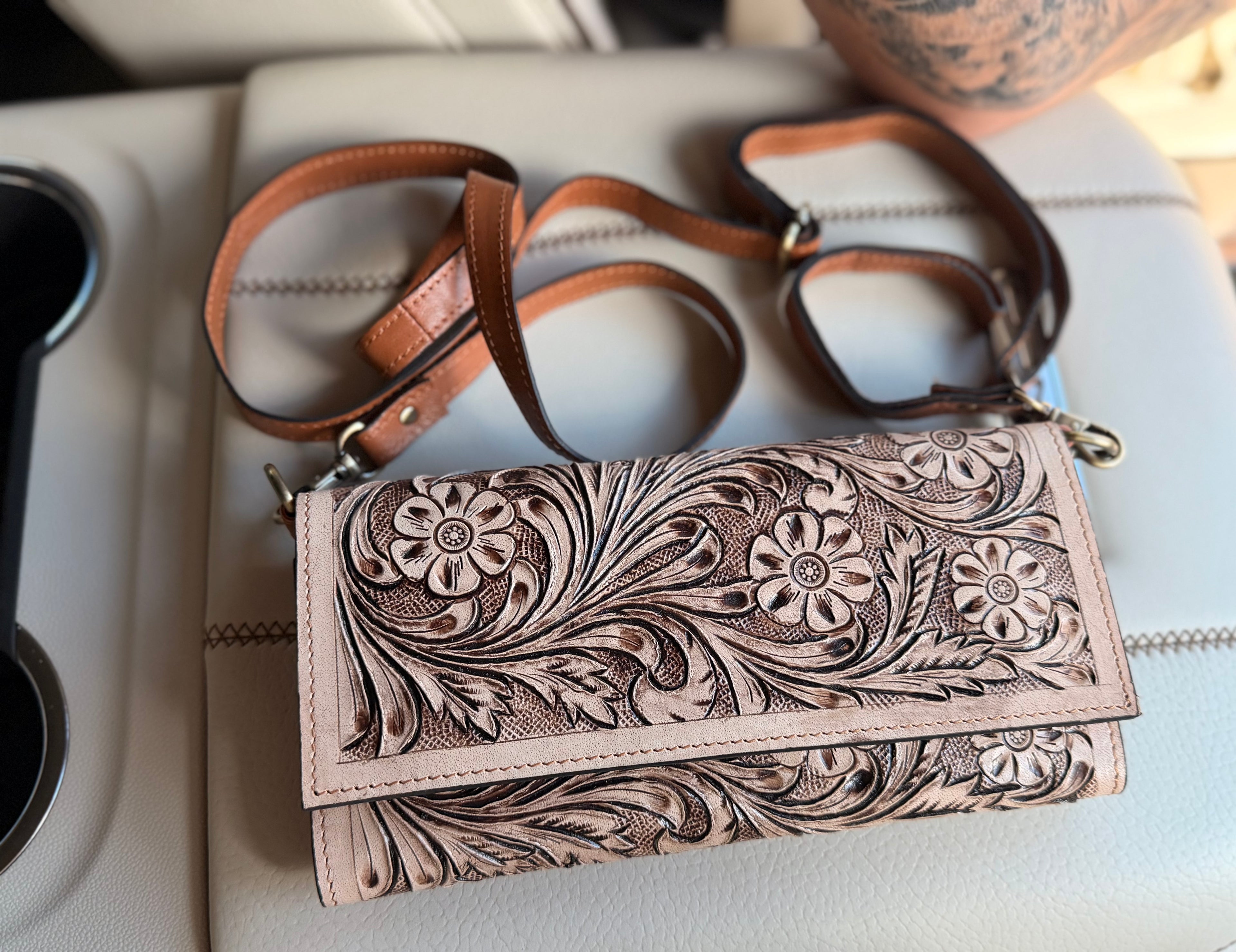 Tooled leather clutch crossbody