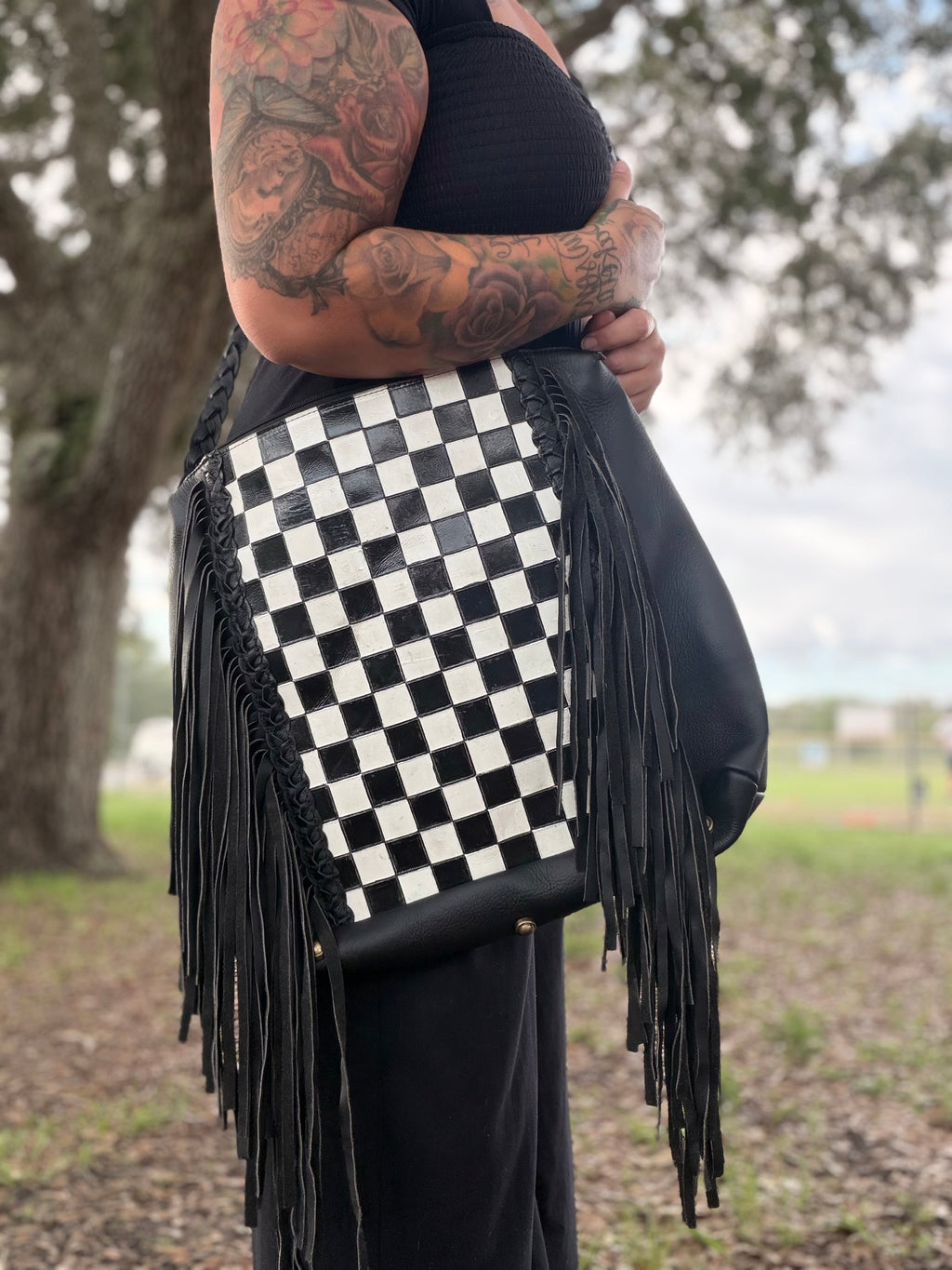 Checker tooled leather hobo bag with fringe