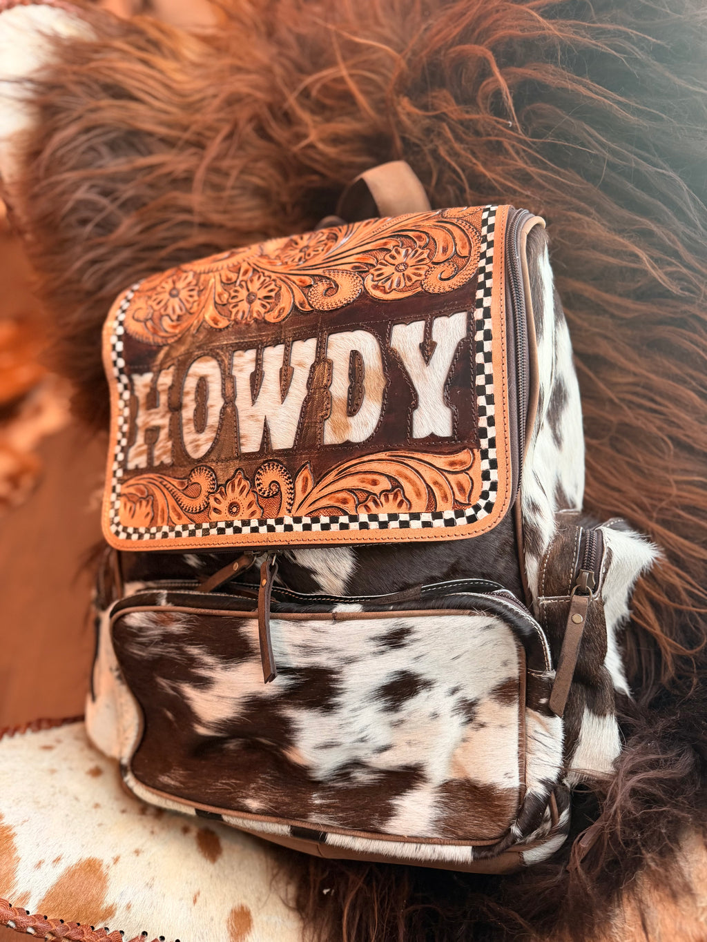 Tooled leather bookbag