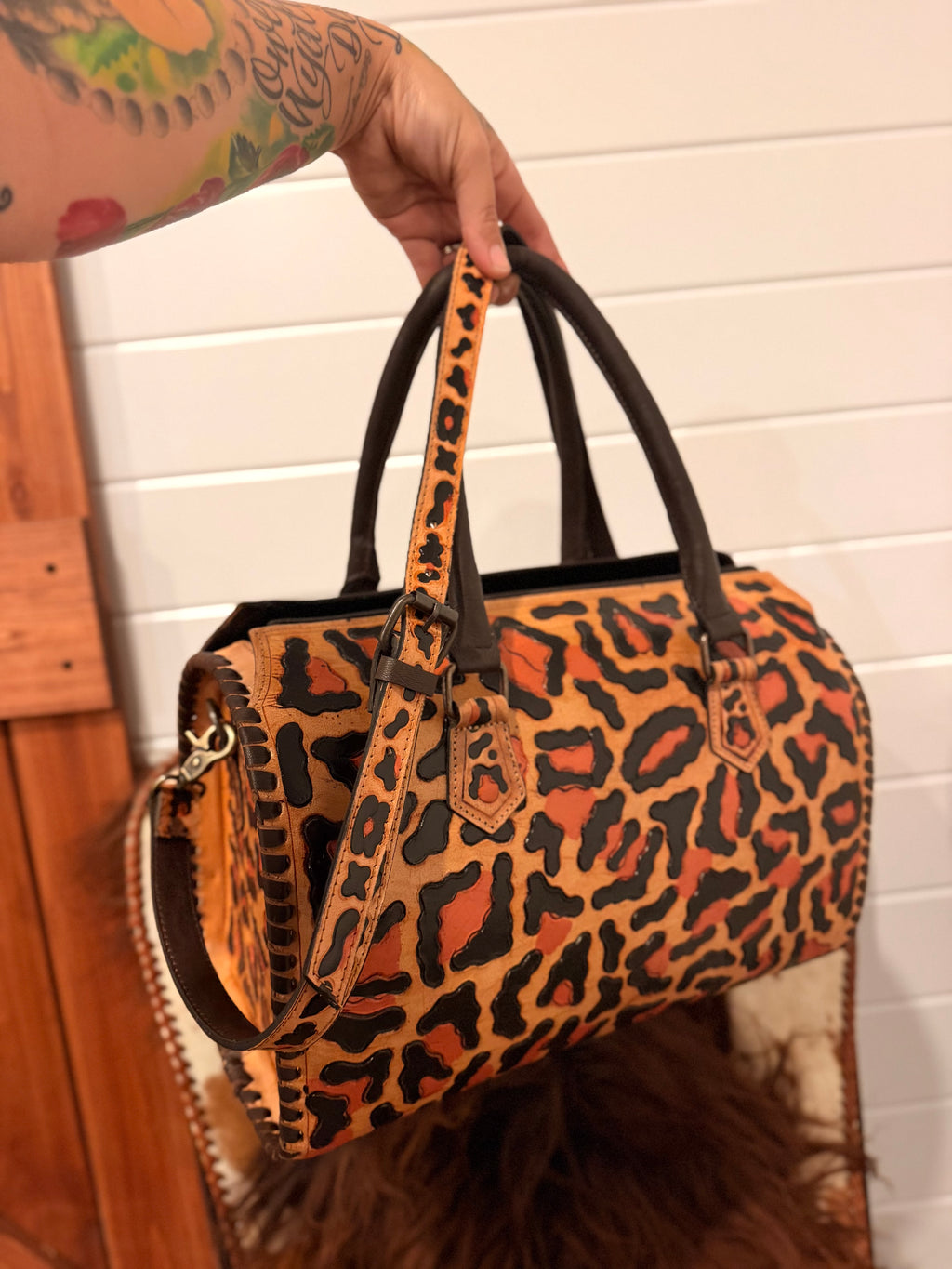 “Western Cheetah” tooled leather speedy duffle (L) by The Painted Porches