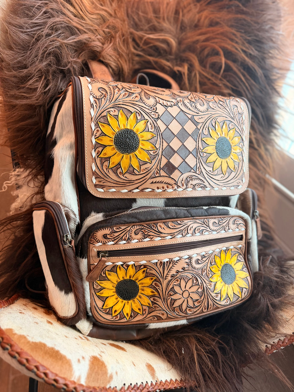 Tooled leather bookbag