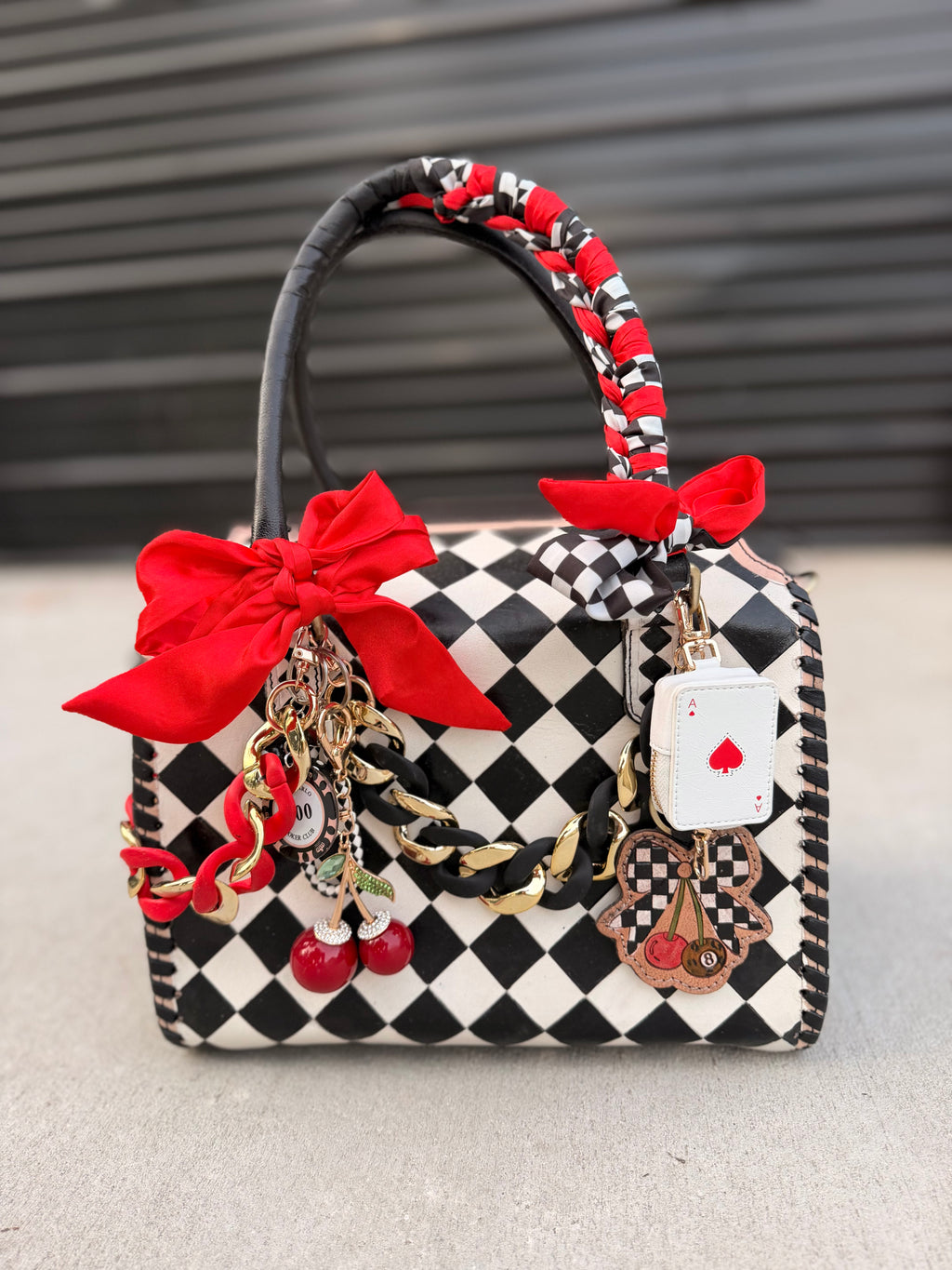 “The Queen of the Casino” tooled checker leather speedy (L)