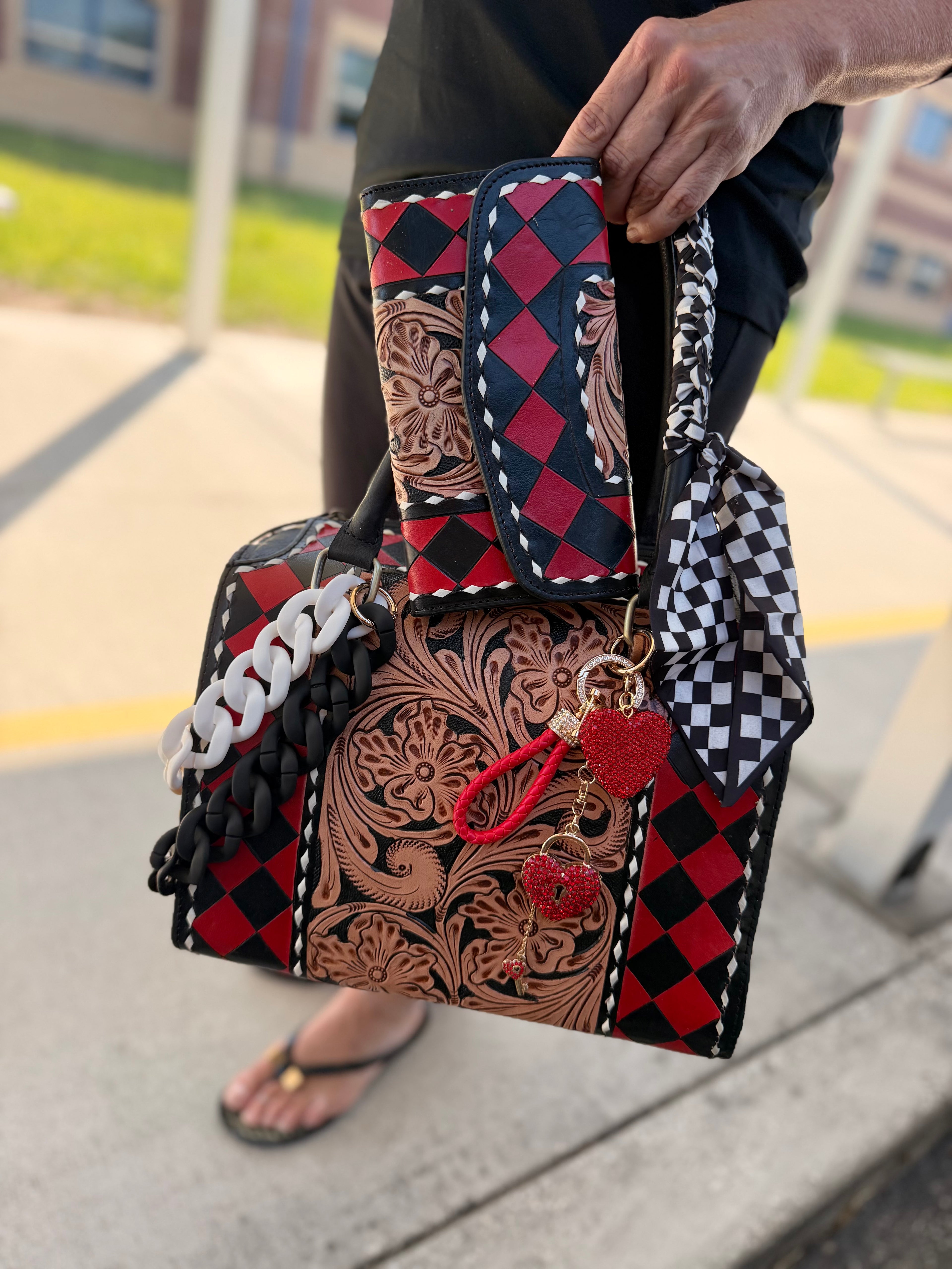 “Harlequin Heiress” red/black check and tooled leather speedy (L) by the Painted Porches