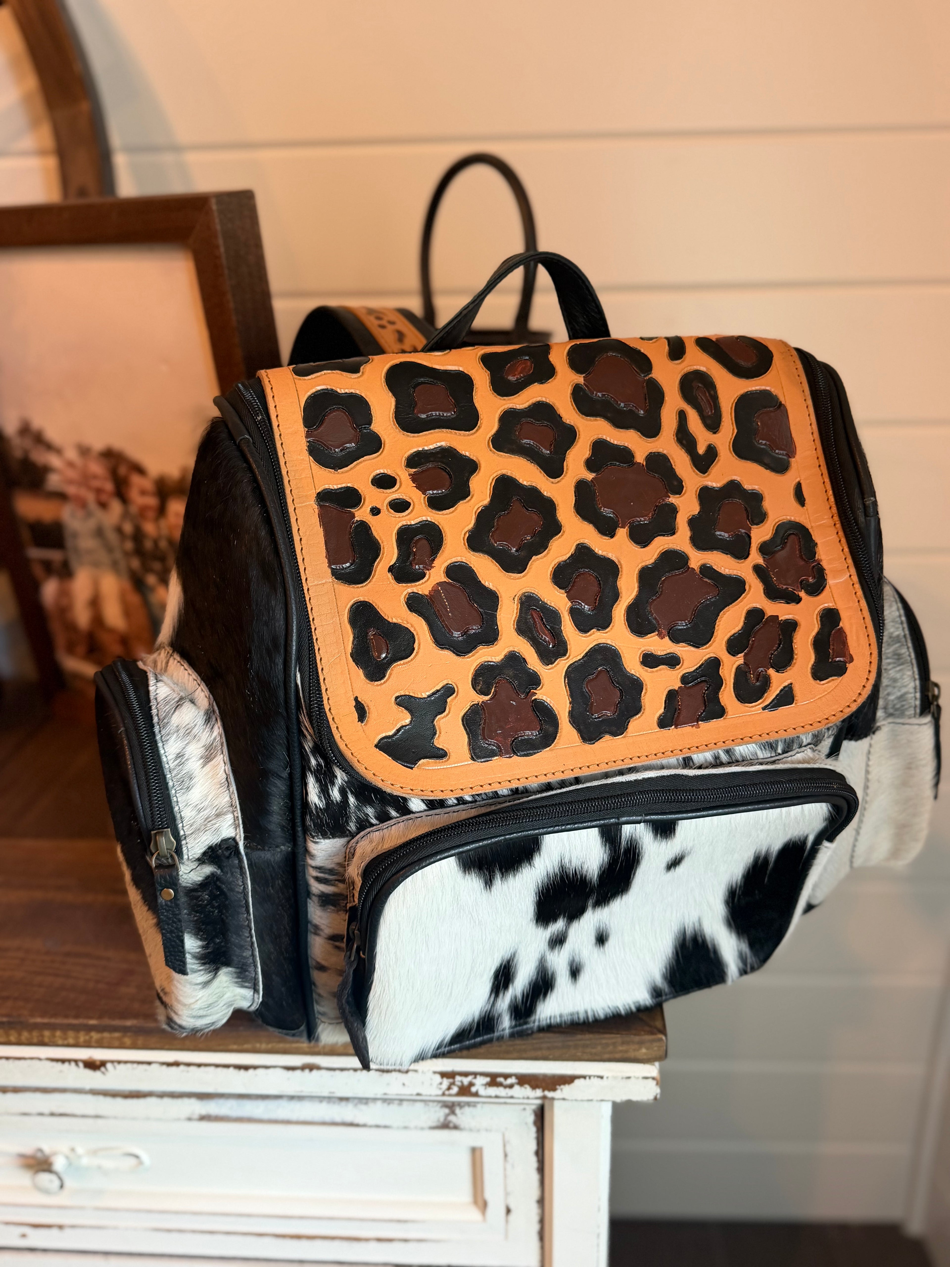 Tooled leather bookbag