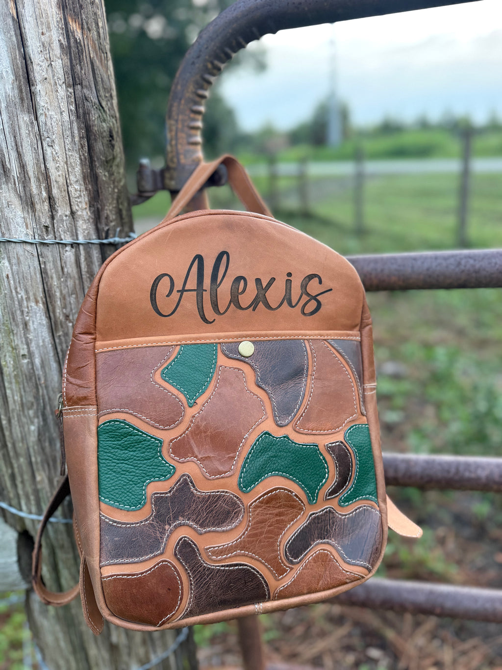 The “Hunter” camo leather bookbag by the Painted Porches