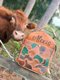 The “Hunter” camo leather bookbag by the Painted Porches