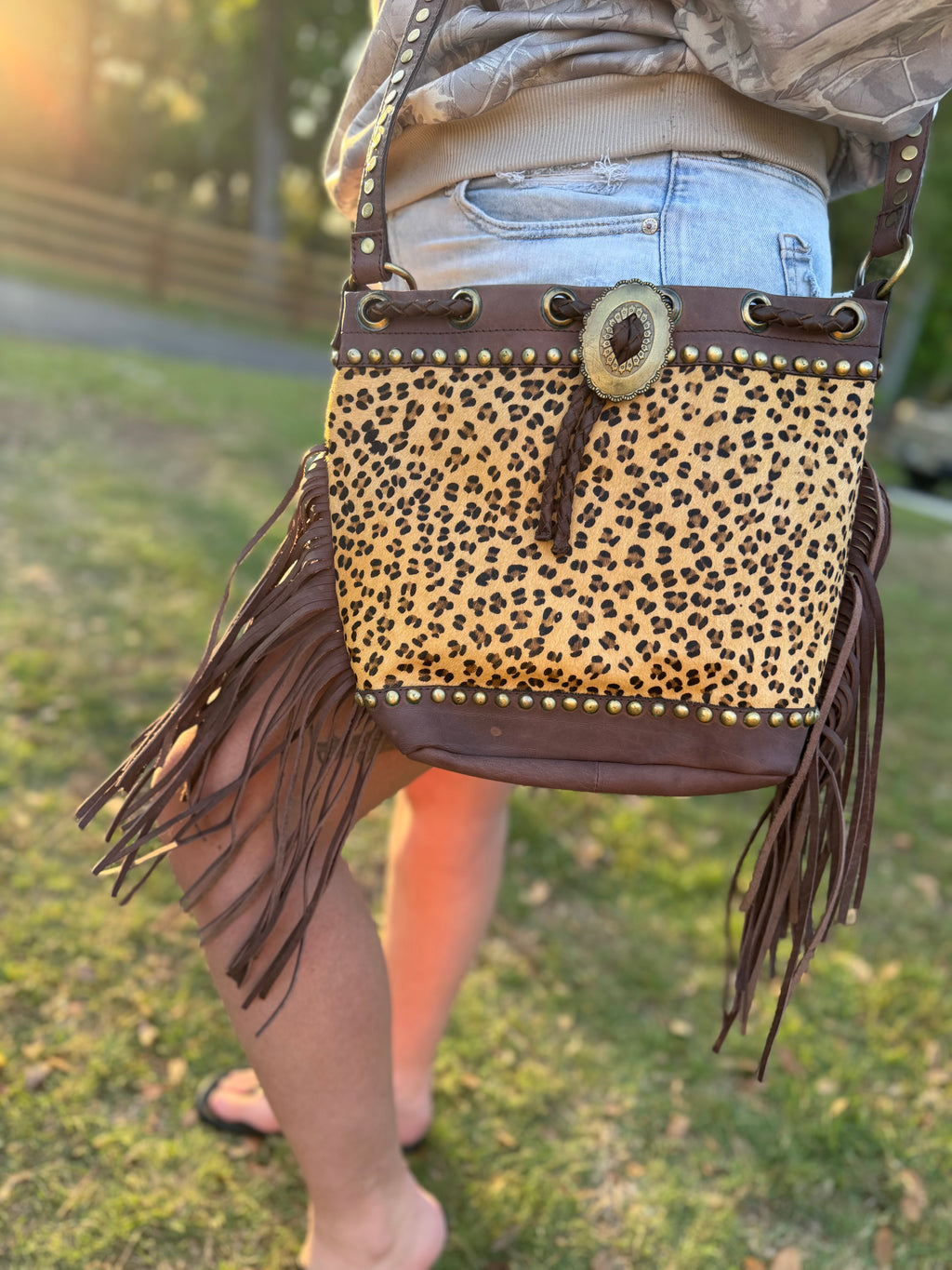 Cheetah print cowhide purse with brown fringe