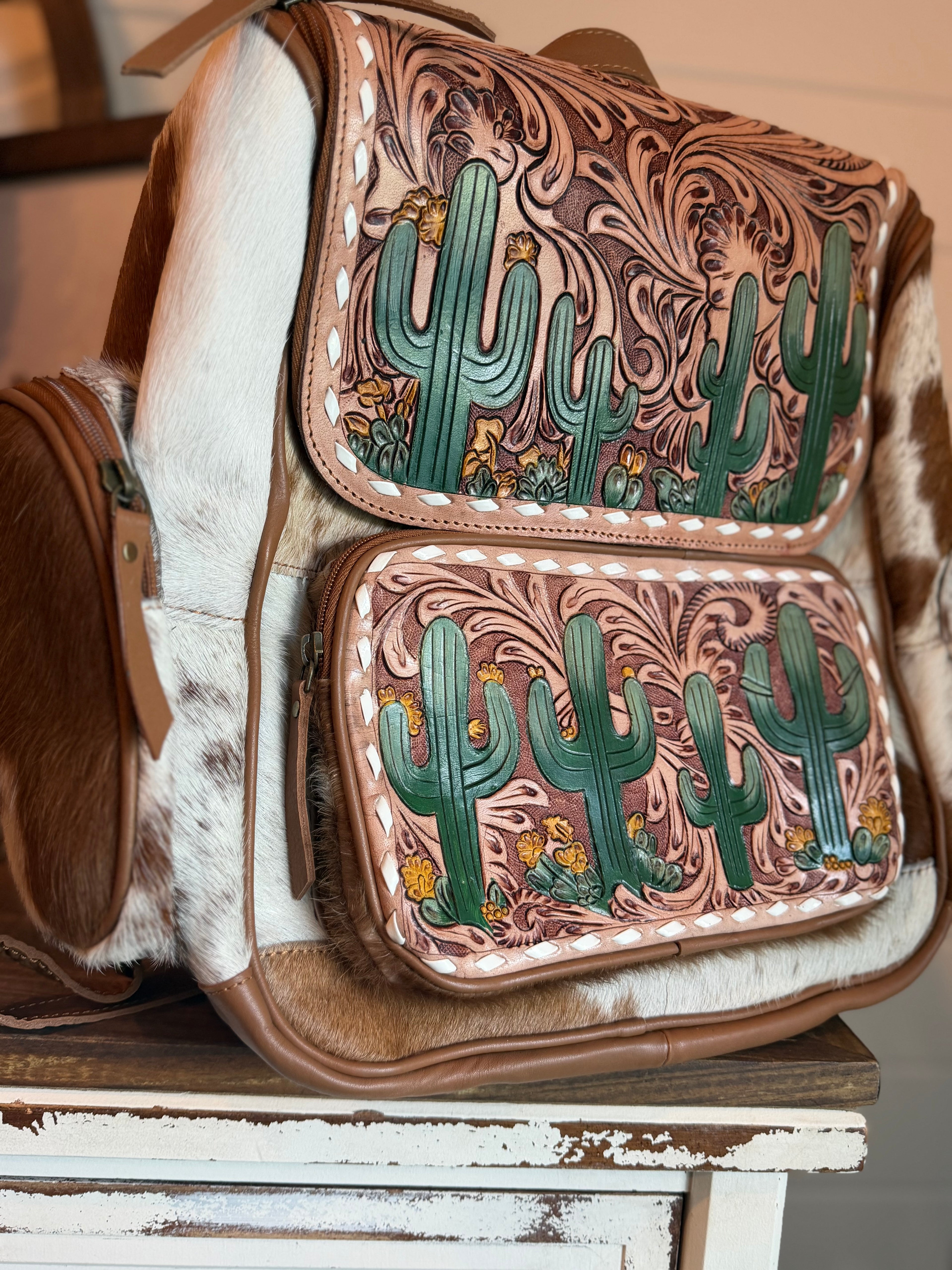 Tooled leather bookbag