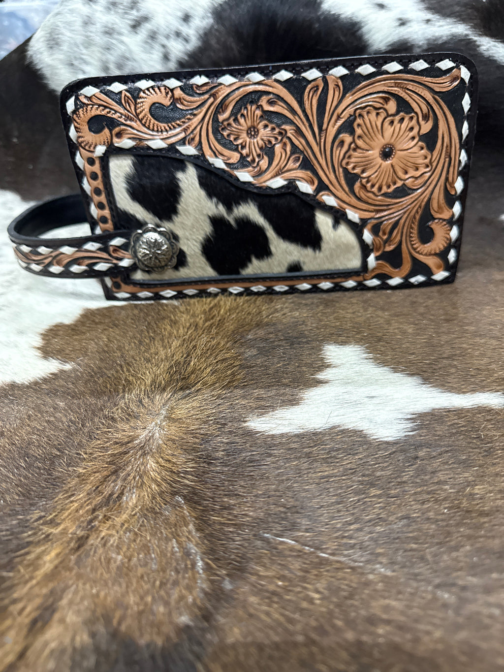 White stitched tooled floral makeup bag
