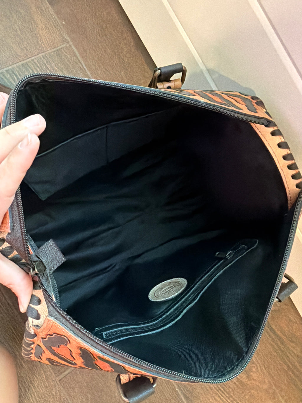 “Western Cheetah” tooled leather speedy duffle (L) by The Painted Porches