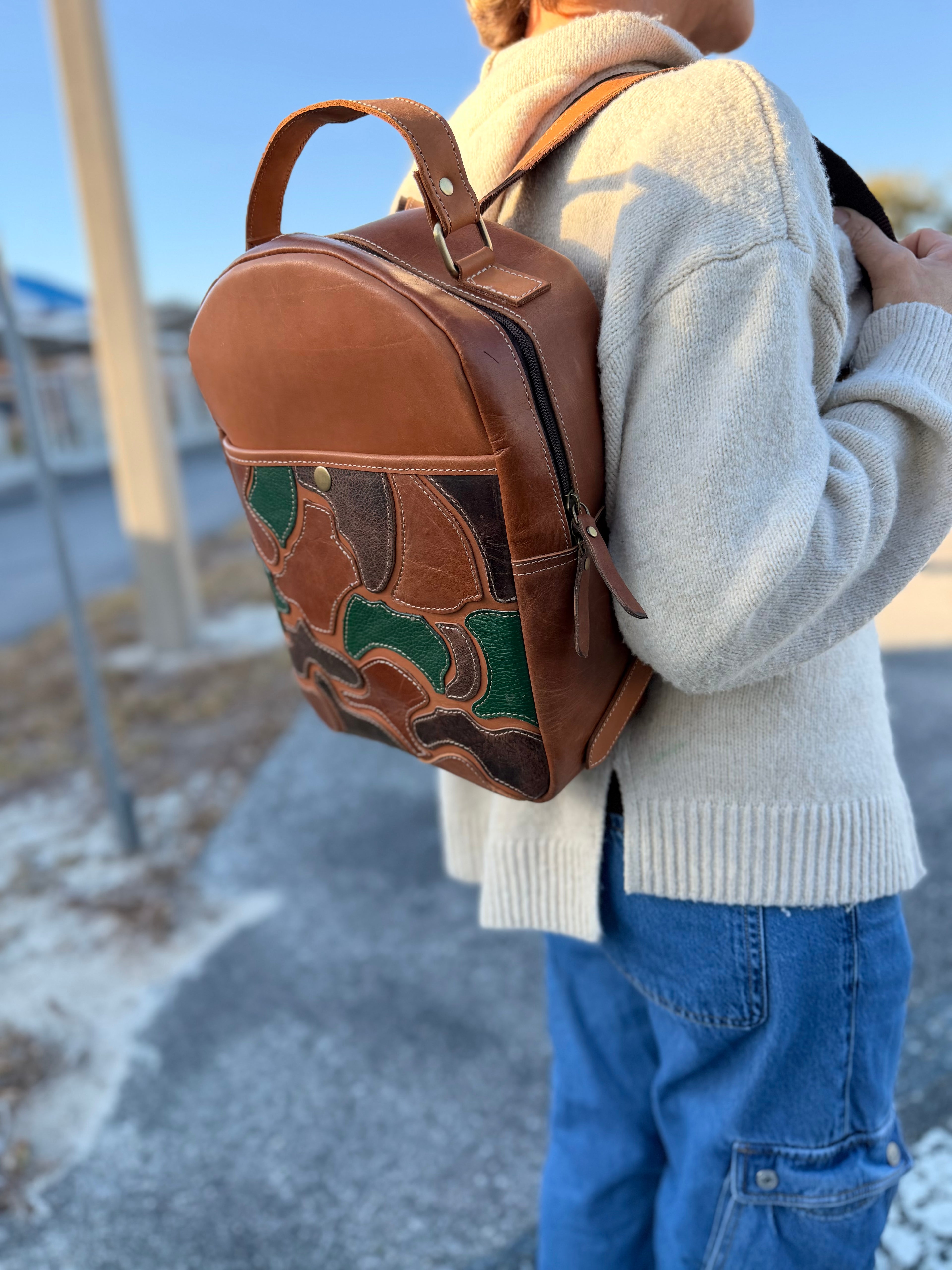 The “Hunter” camo leather bookbag by the Painted Porches