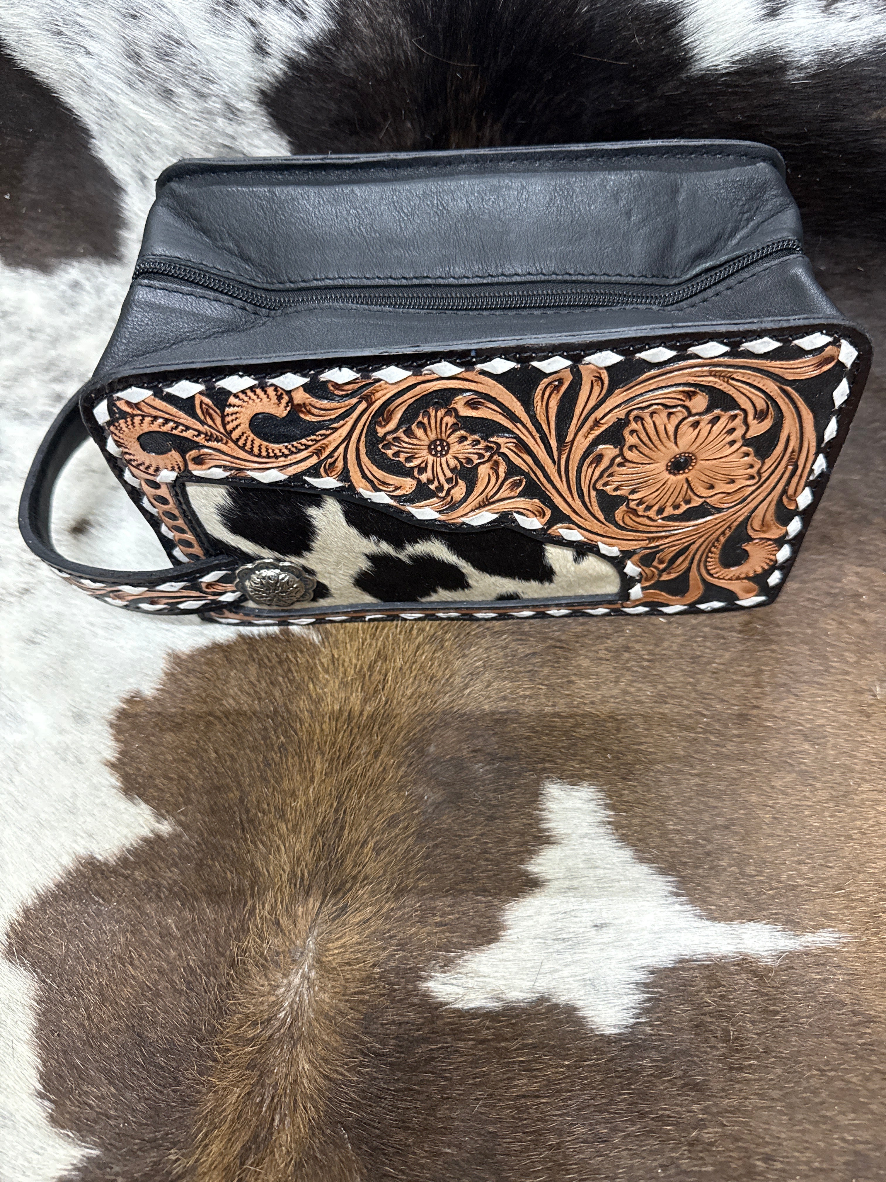 White stitched tooled floral makeup bag