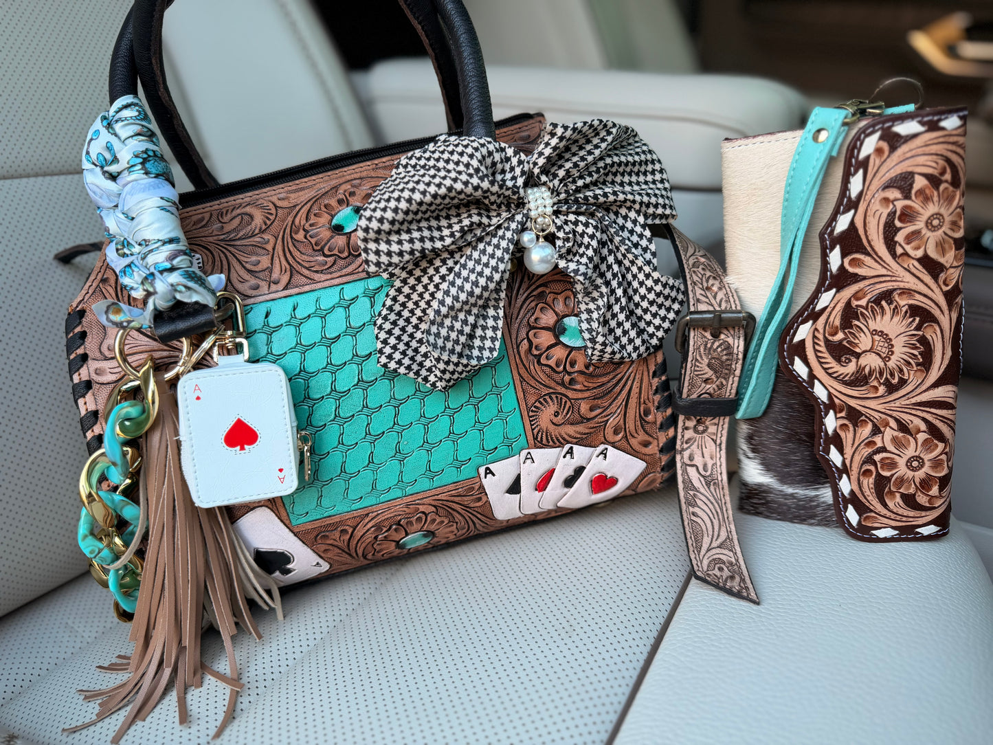 “The Boot Scootin’ Jackpot" - tan tooled leather speedy (M)