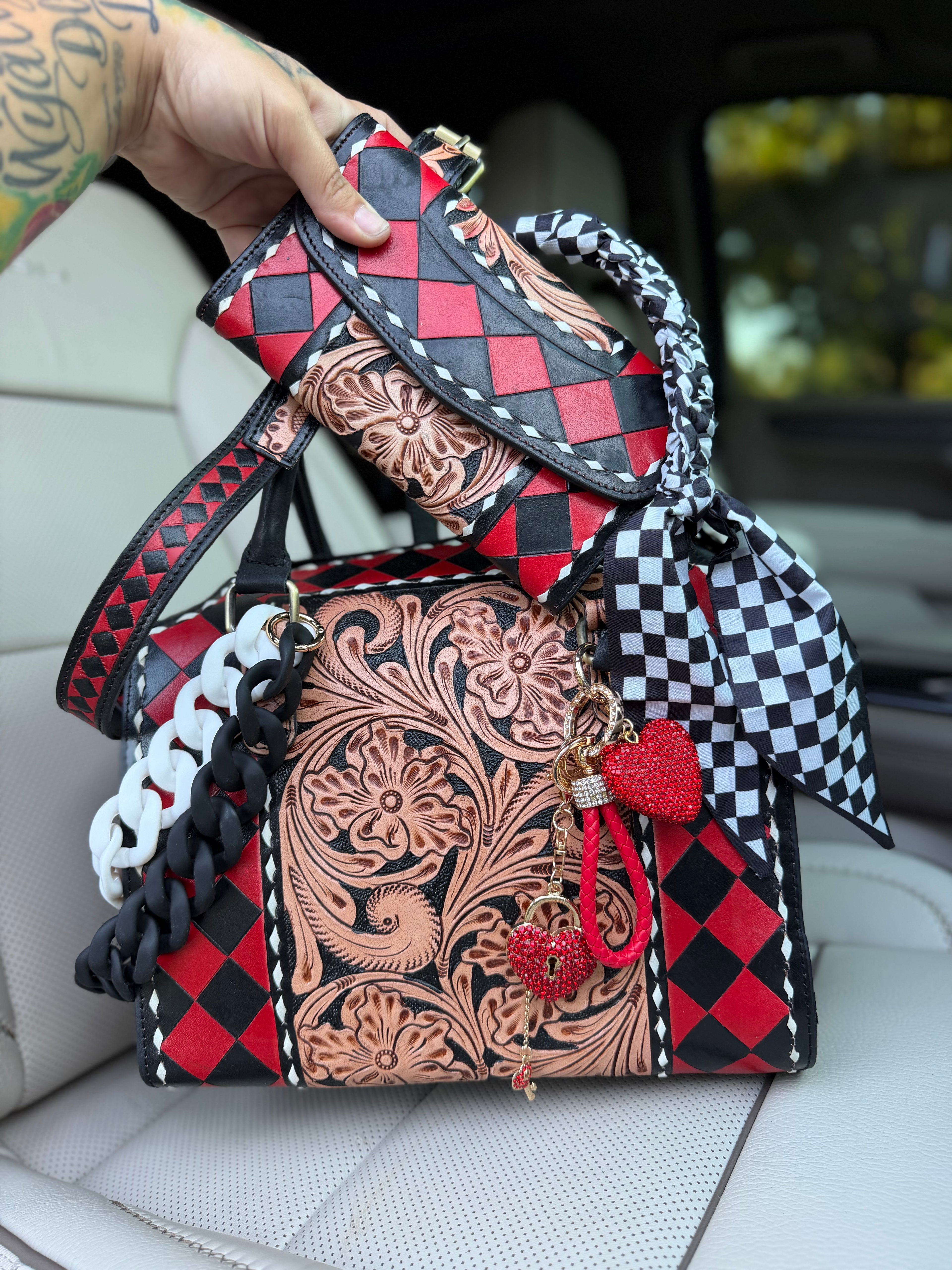 “Harlequin Heiress” red/black check and tooled leather speedy (L) by the Painted Porches