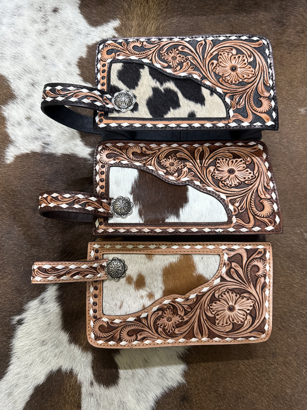 White stitched tooled floral makeup bag