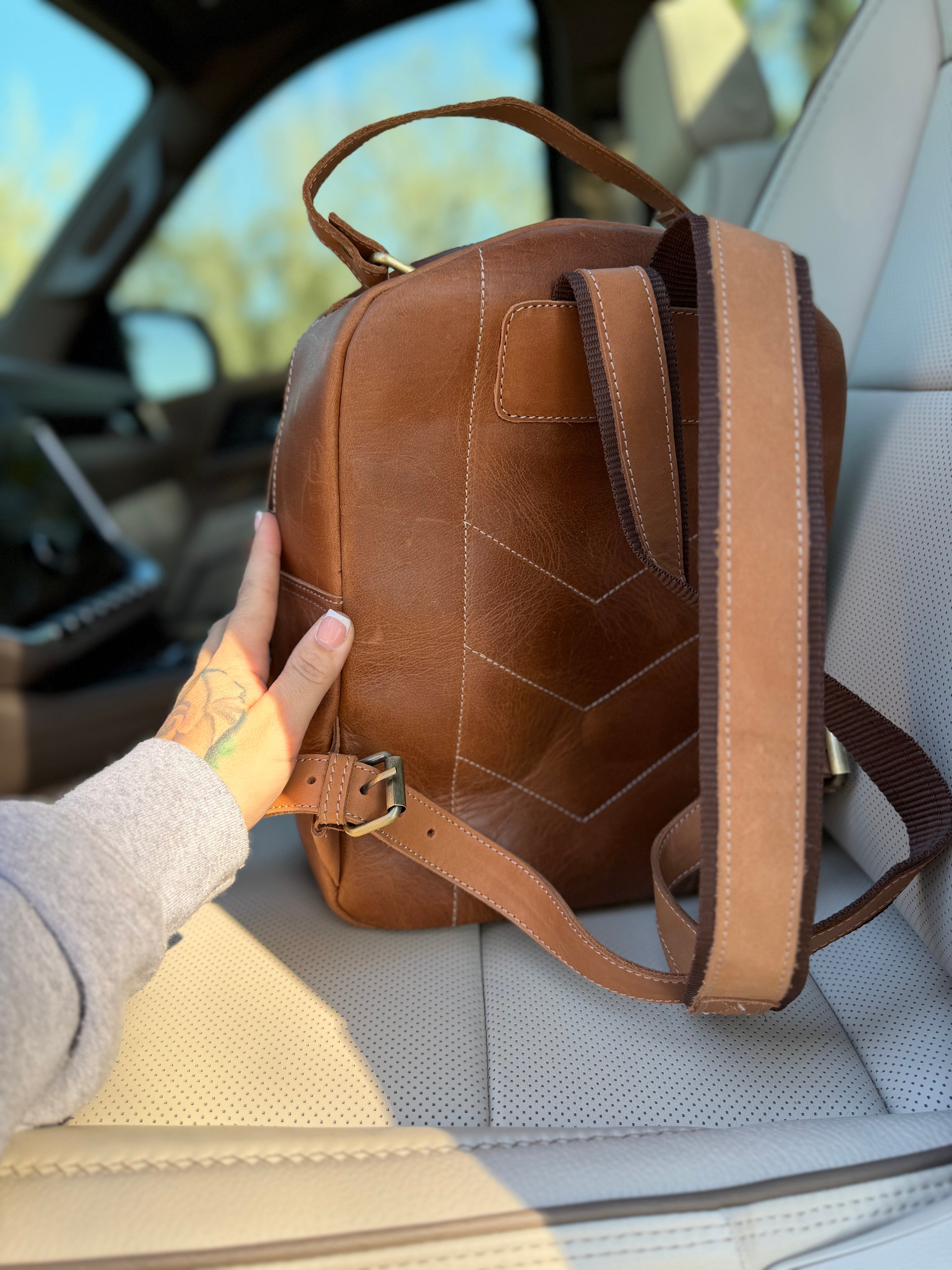 The “Hunter” camo leather bookbag by the Painted Porches
