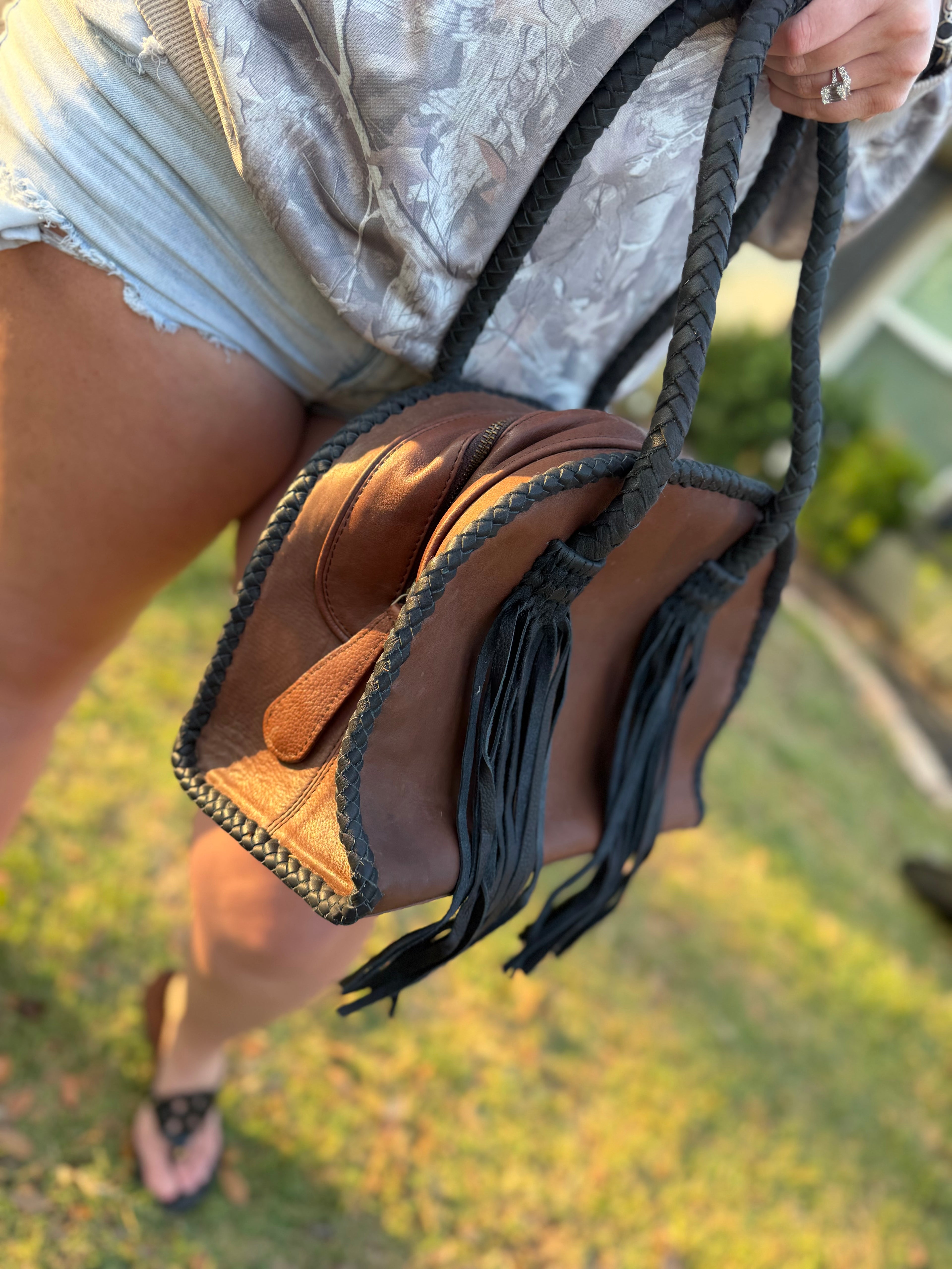 Leather purse with black fringe