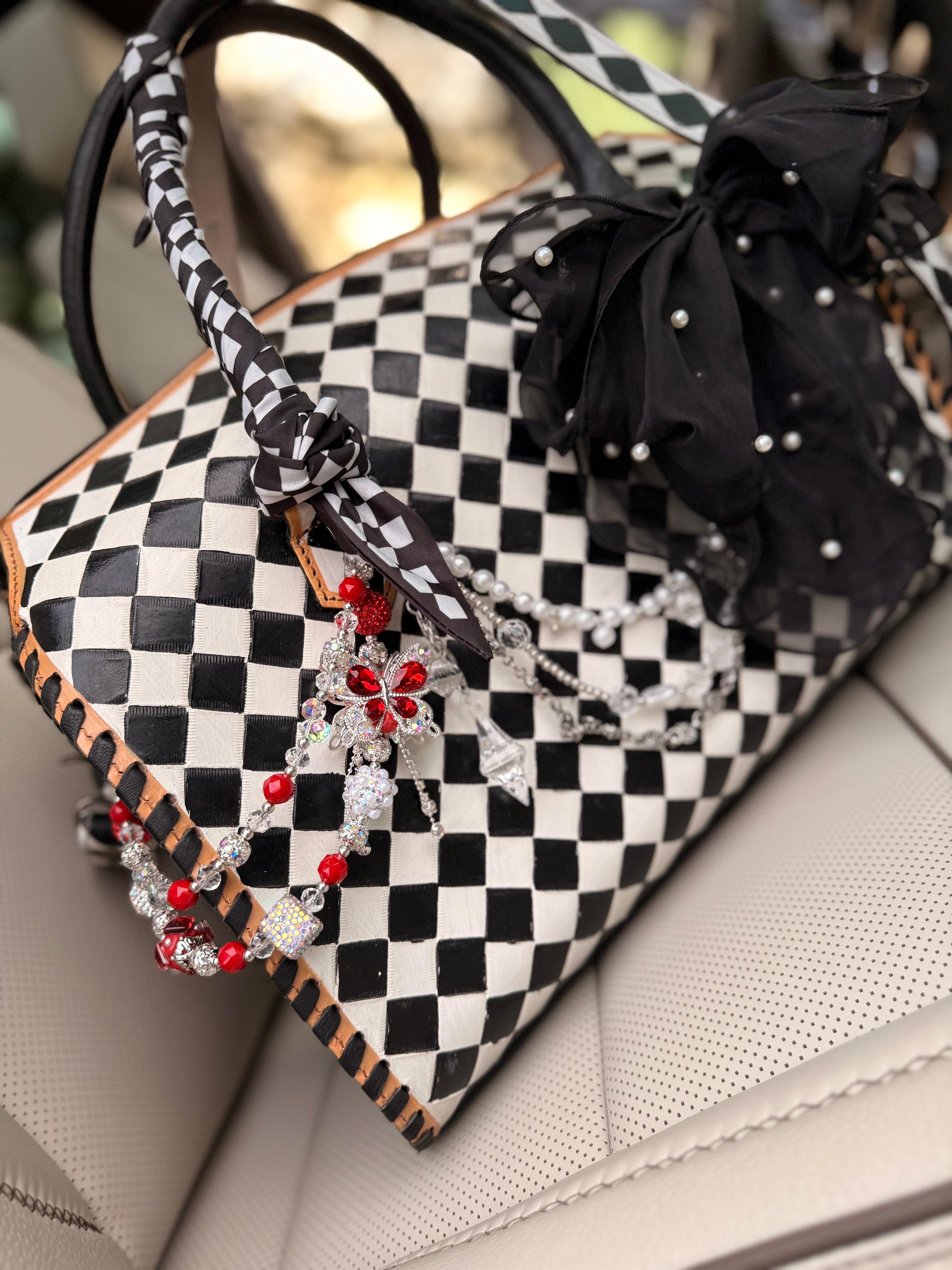 "Black tie chaos”- checker tooled leather speedy Duffle