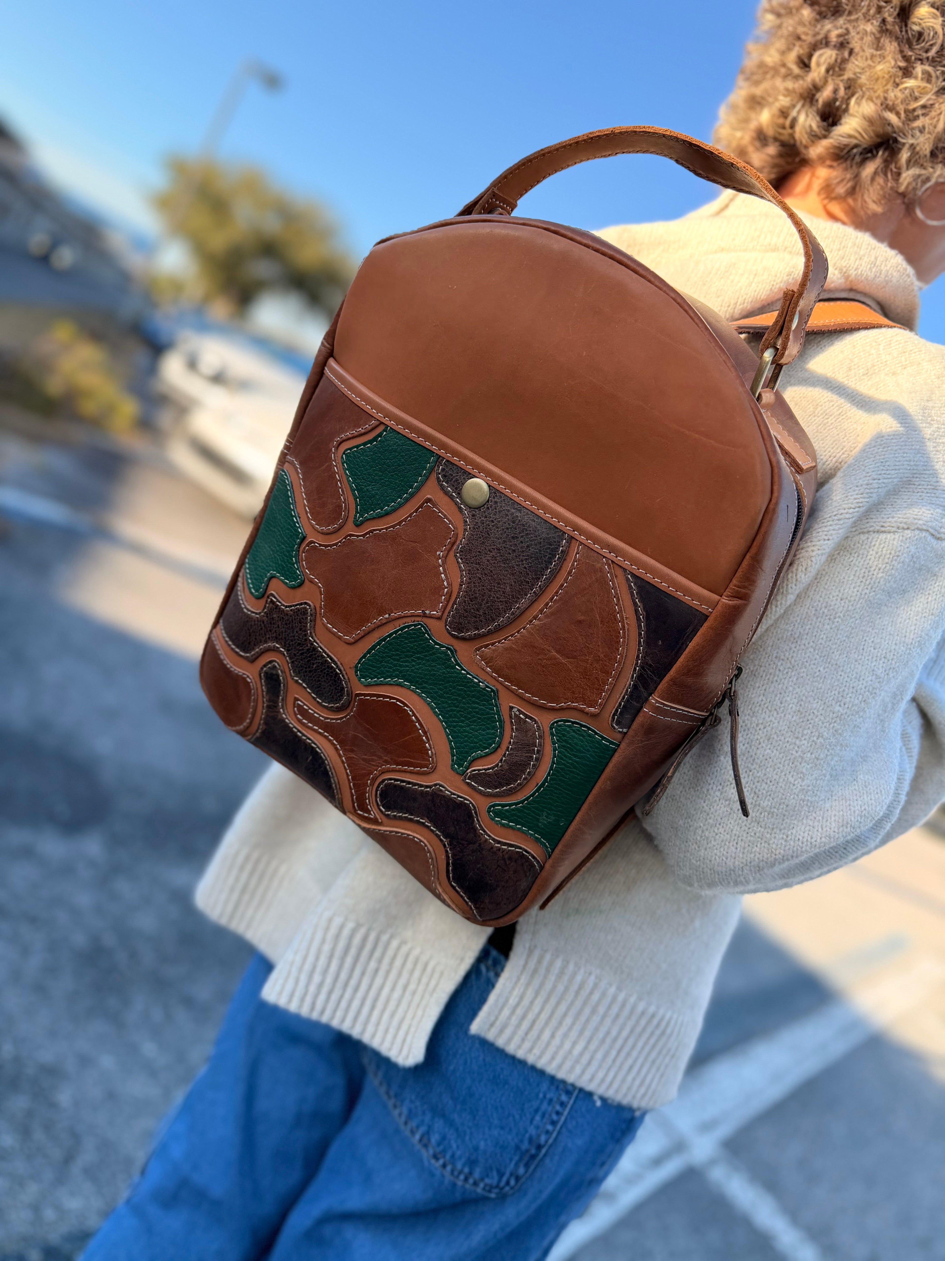 The “Hunter” camo leather bookbag by the Painted Porches