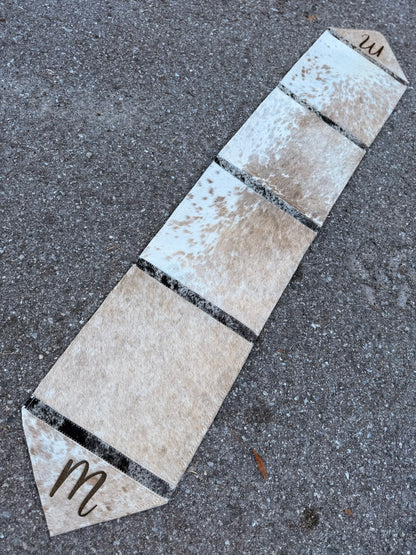 Table runner includes engraving initial