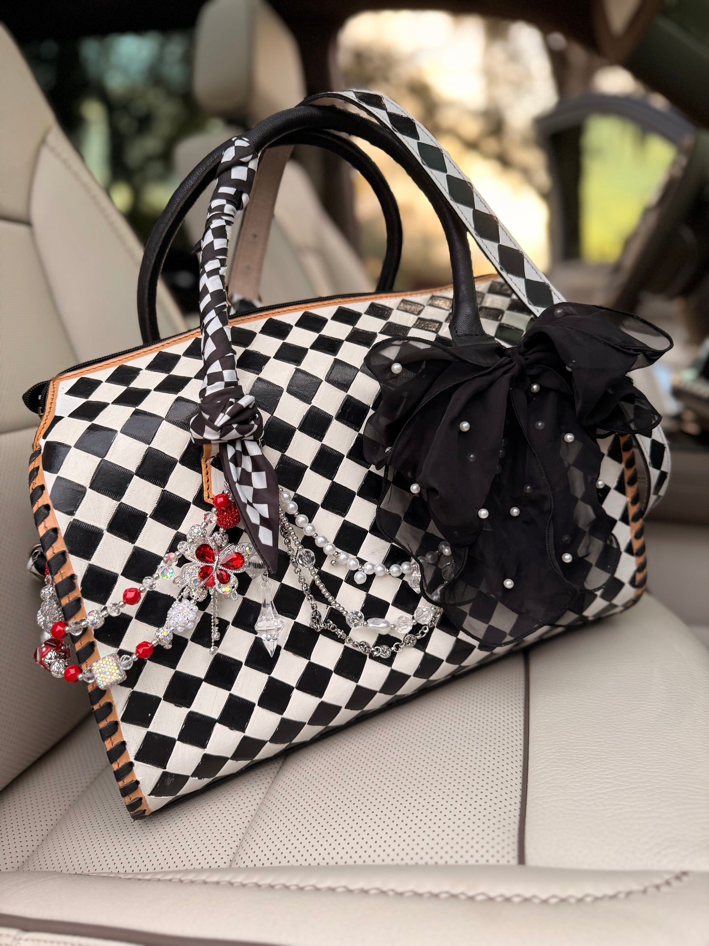 "Black tie chaos”- checker tooled leather speedy Duffle