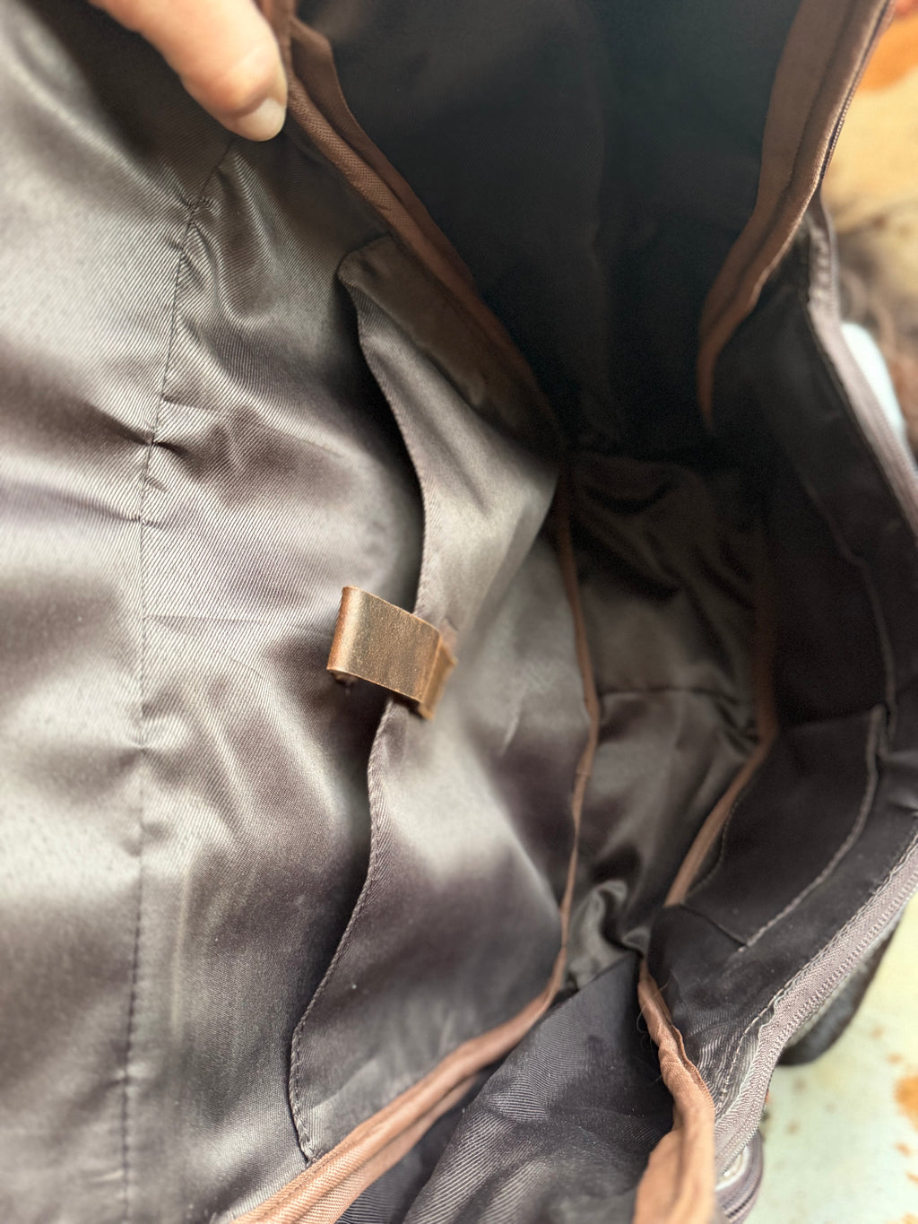 Tooled leather bookbag