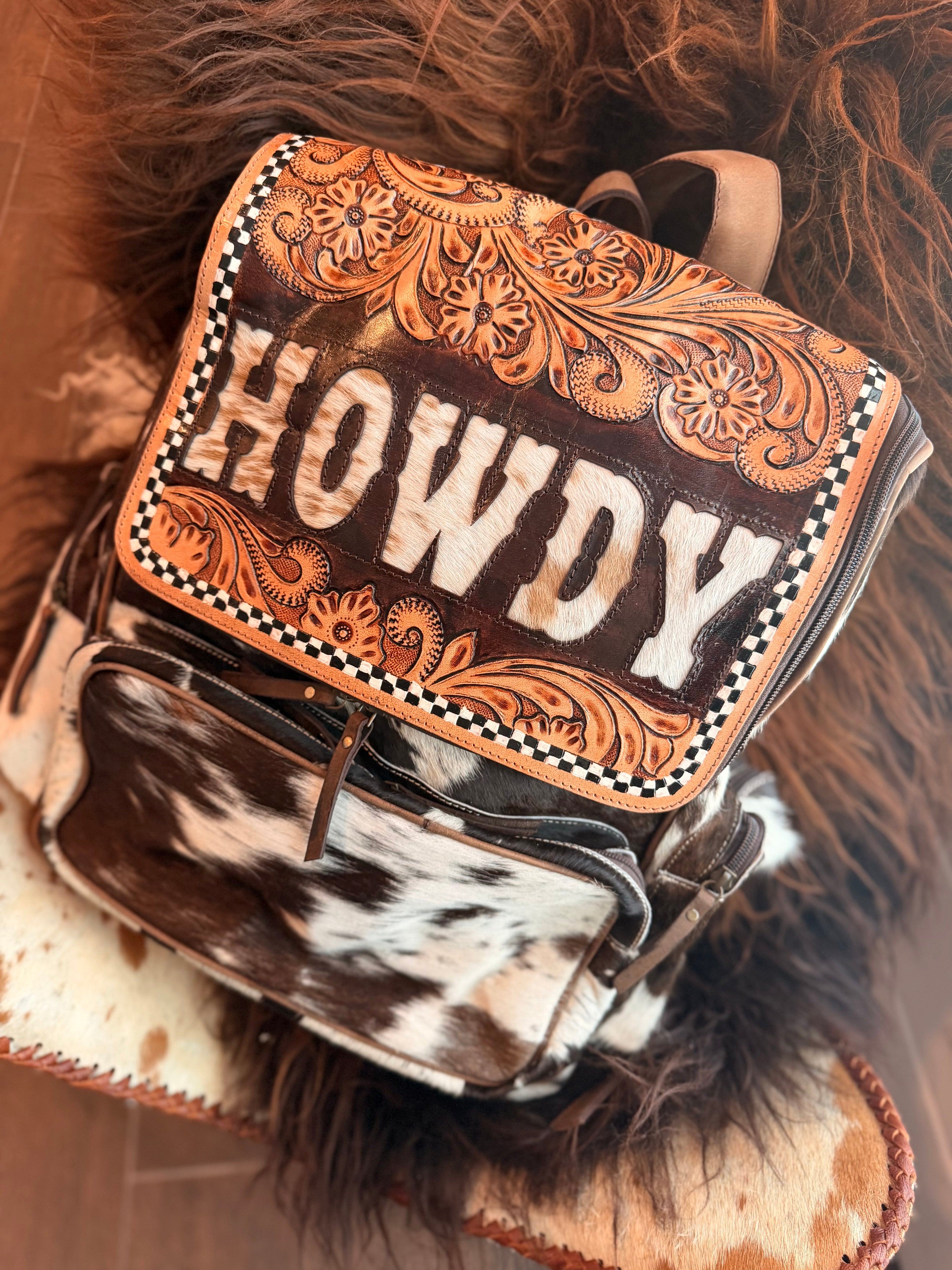 Tooled leather bookbag