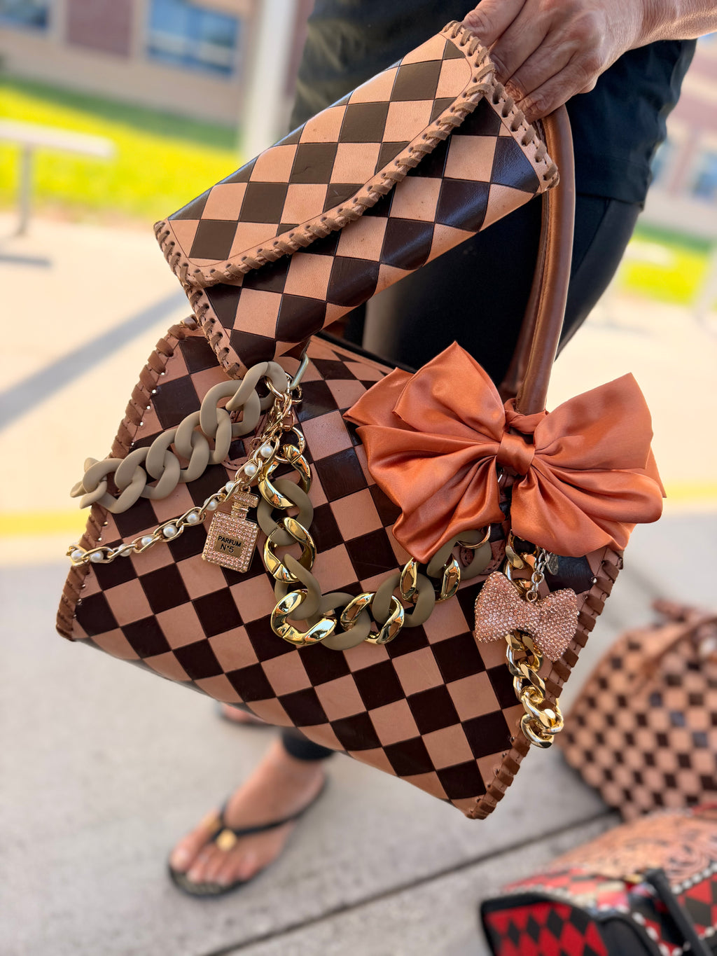 “Southern Queen“ peanut butter checker tooled leather speedy (L) by the Painted Porches