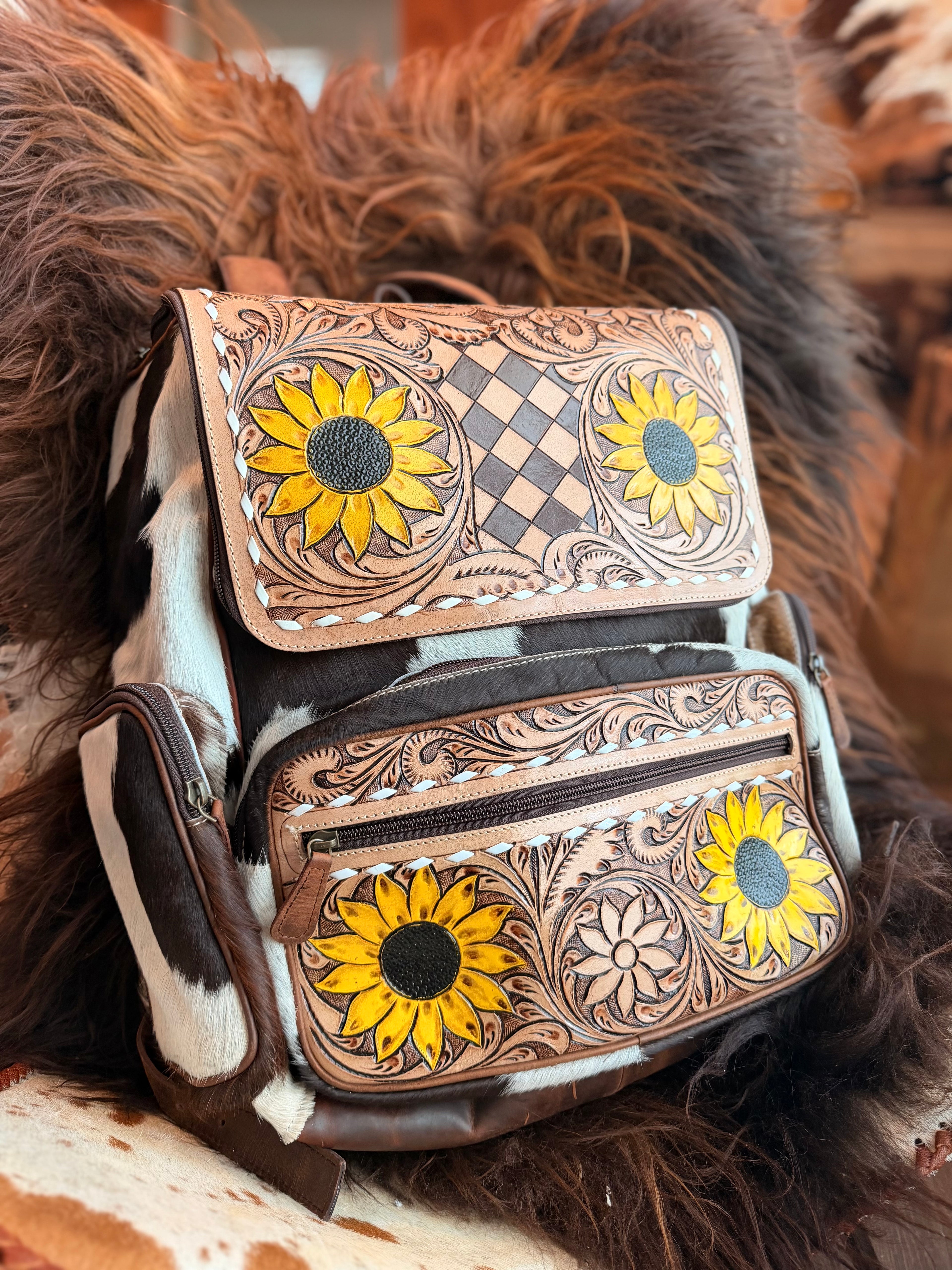 Tooled leather bookbag