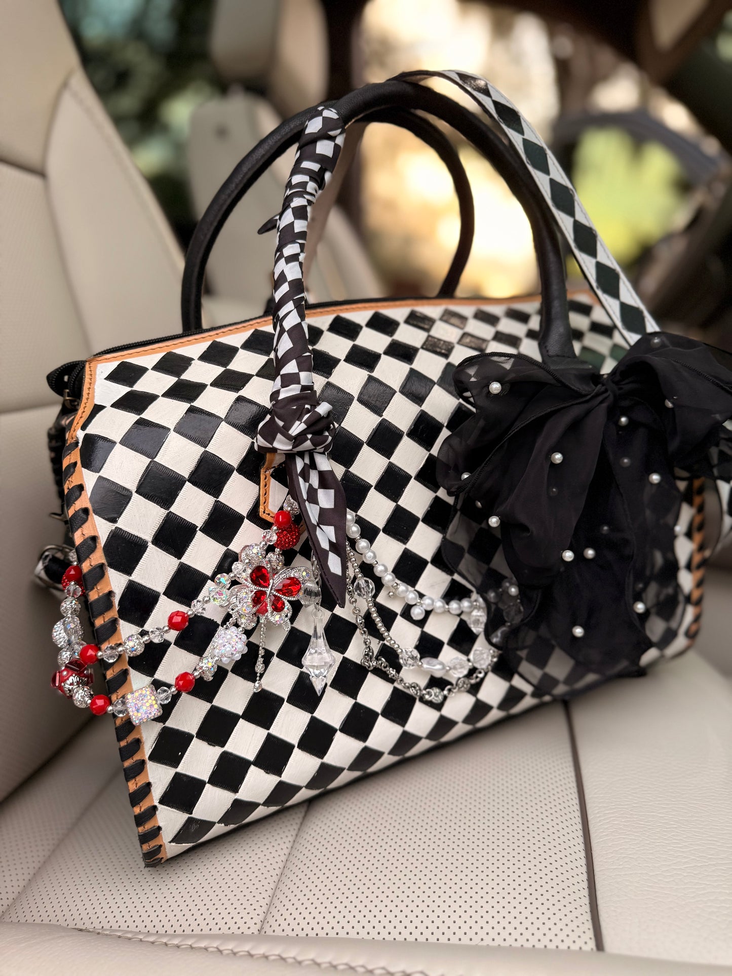 "Black tie chaos”- checker tooled leather speedy Duffle