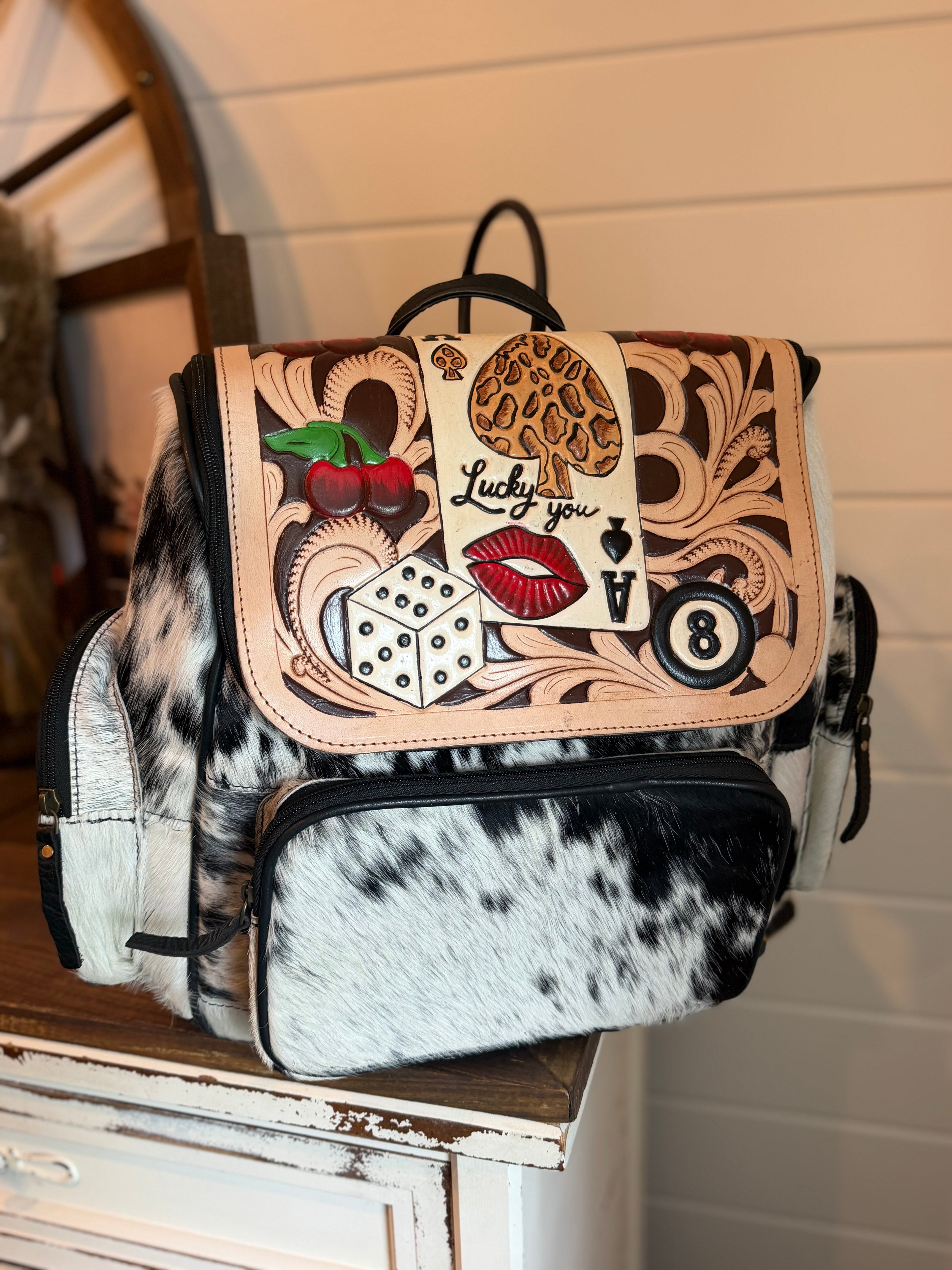 Tooled leather bookbag