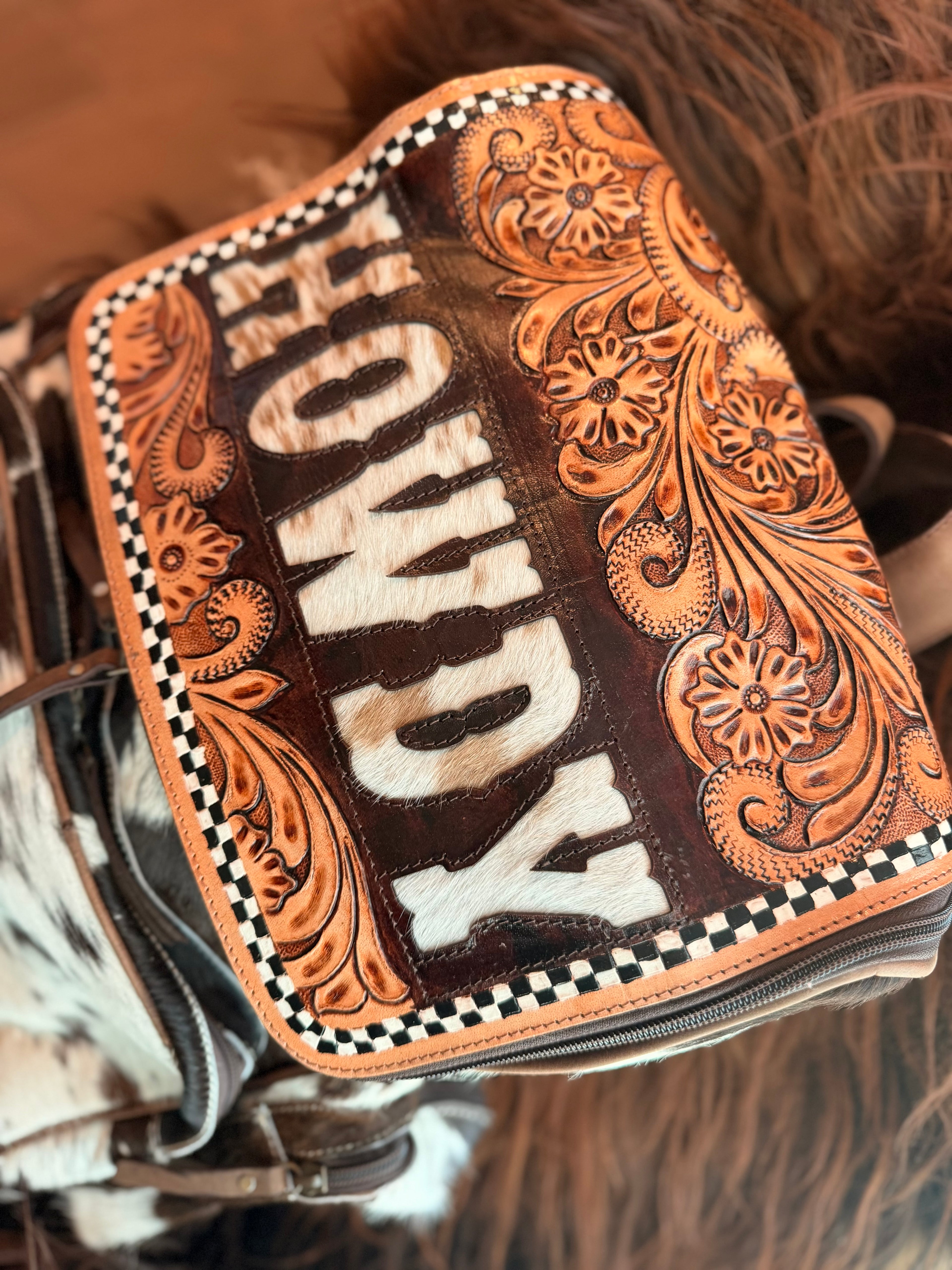 Tooled leather bookbag