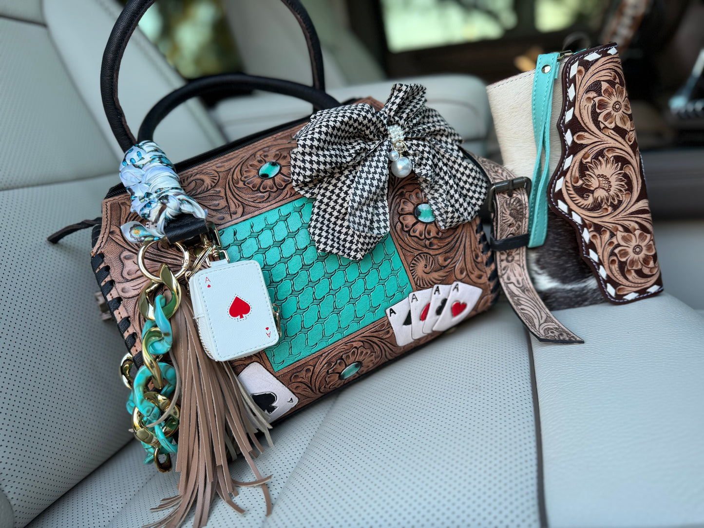 “The Boot Scootin’ Jackpot" - tan tooled leather speedy (M)