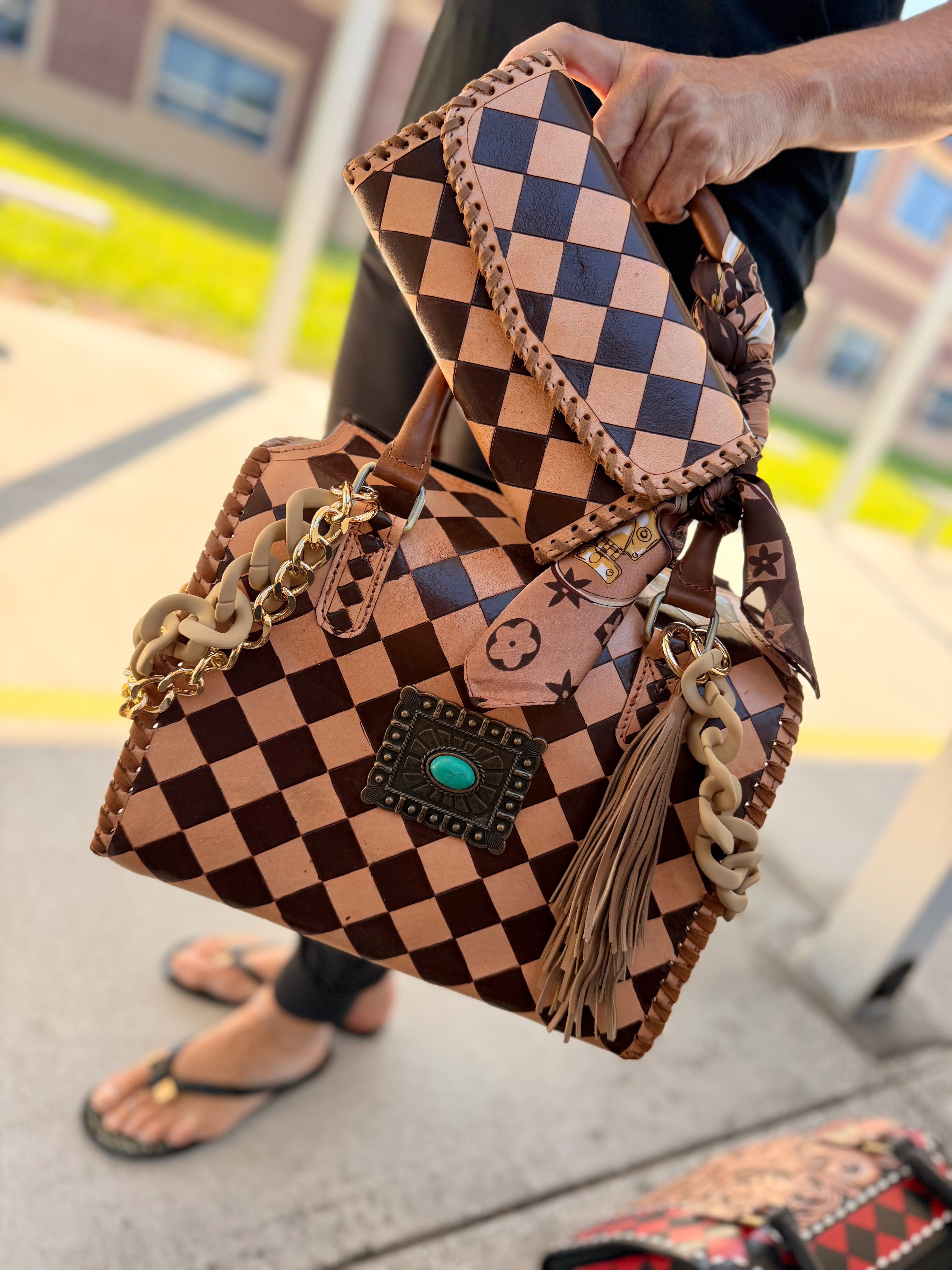 “Cowgirl Couture” peanut butter checker tooled leather speedy (L) by the Painted Porches
