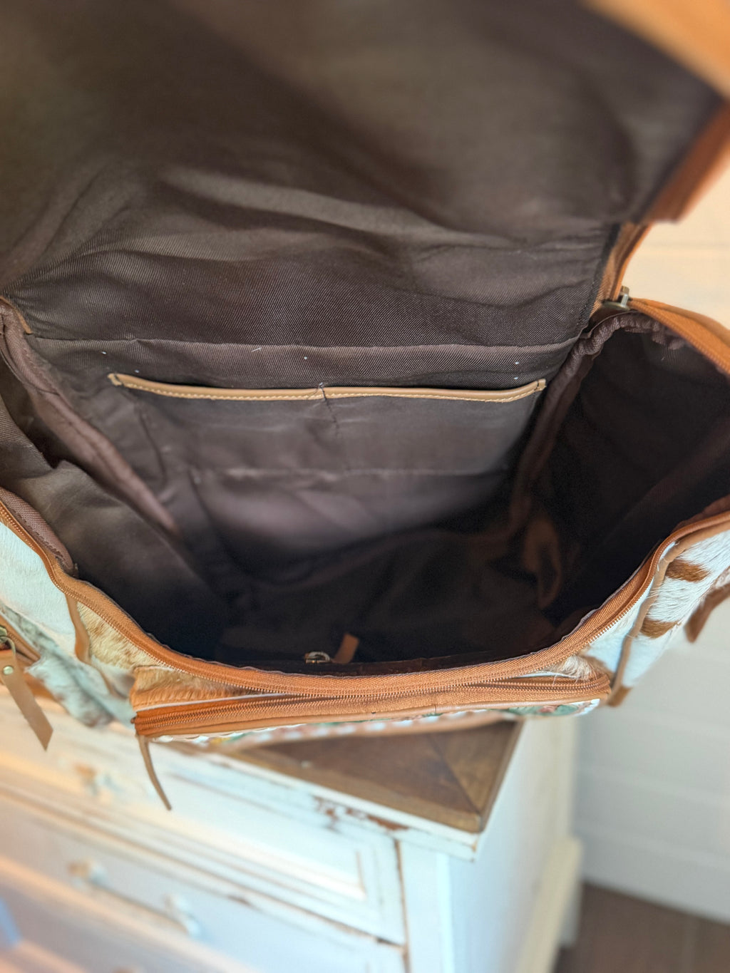 Tooled leather bookbag
