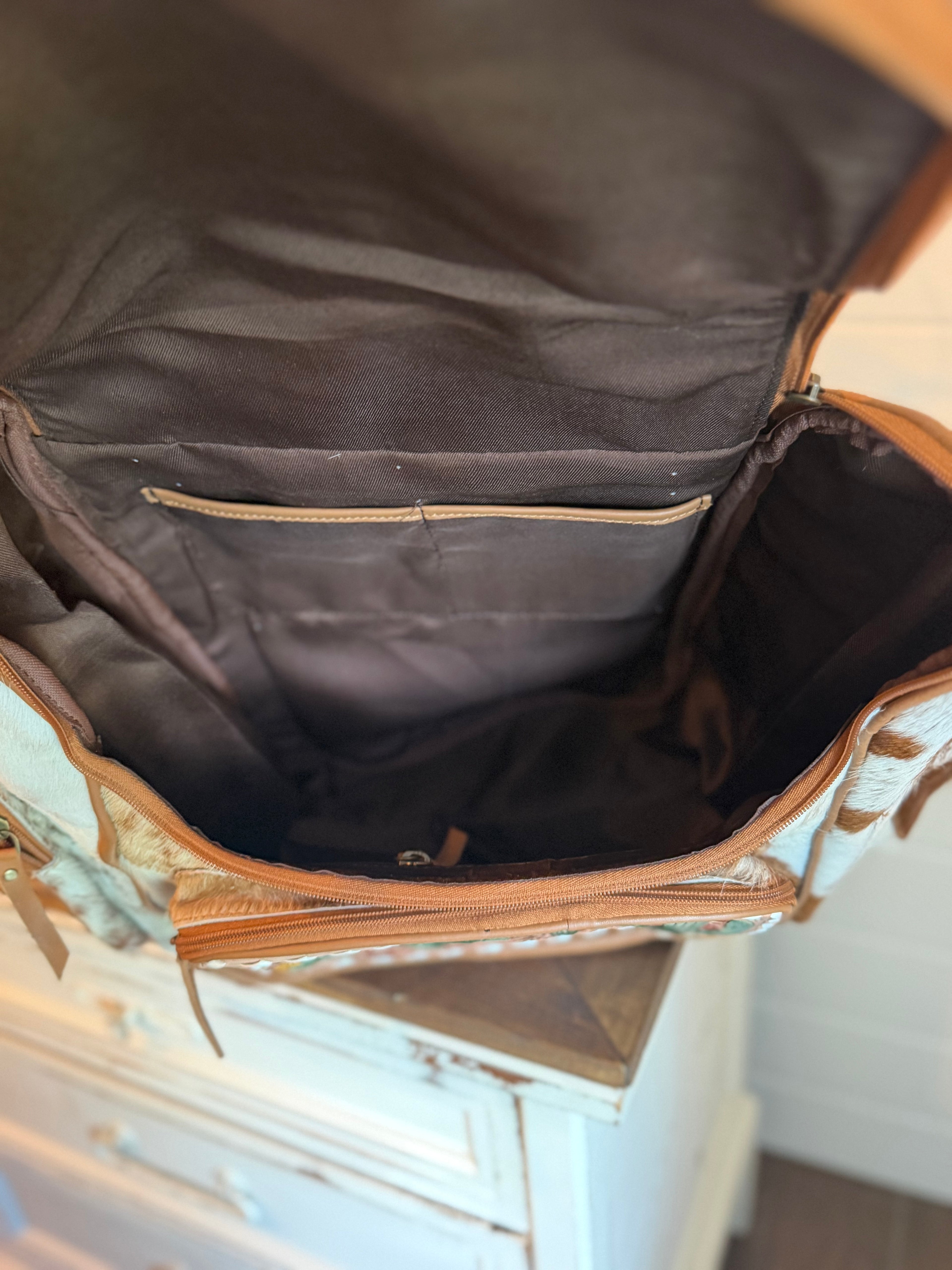 Tooled leather bookbag