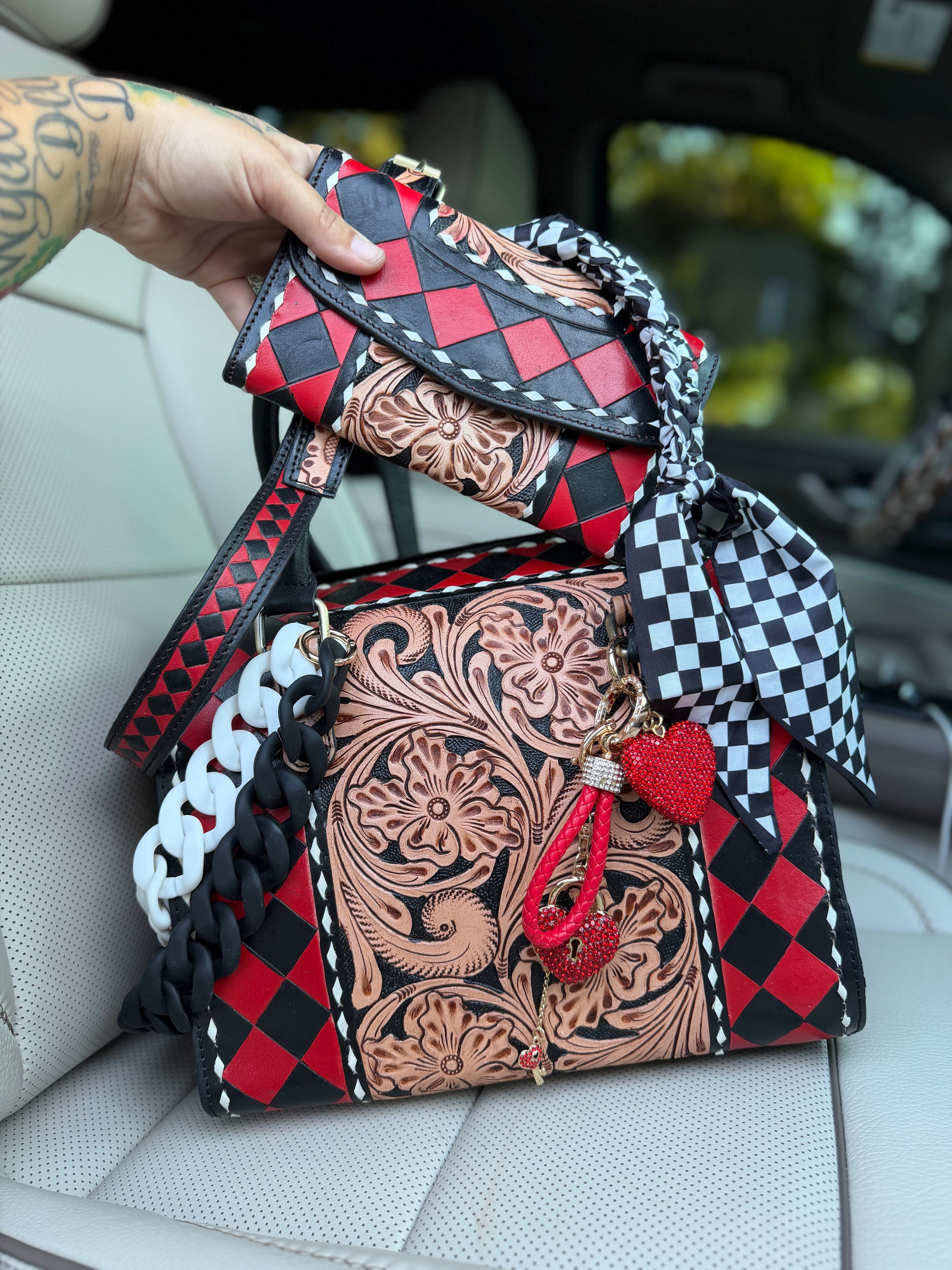 “Harlequin Heiress” red/black check and tooled leather speedy (L) by the Painted Porches