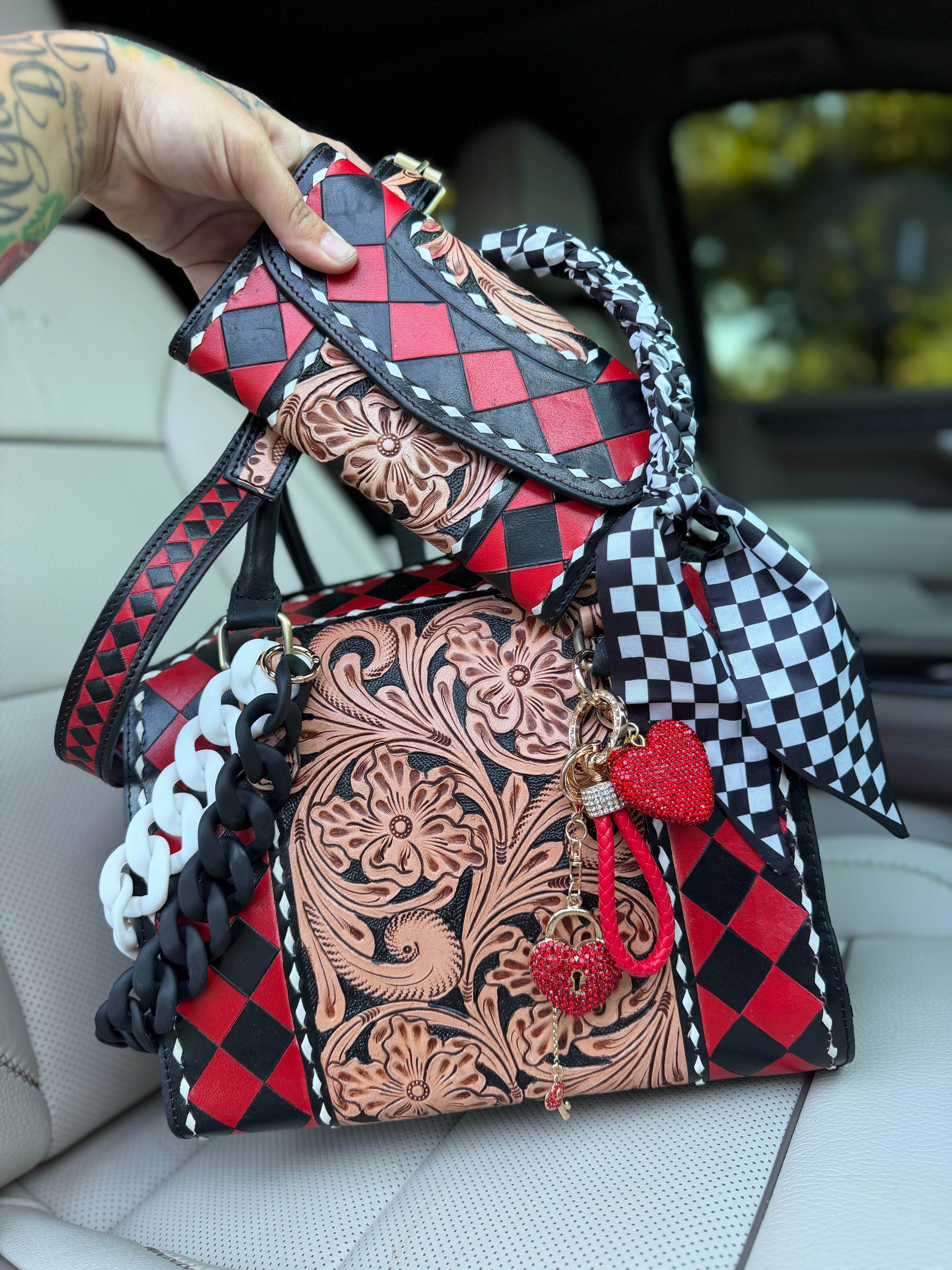 “Harlequin Heiress” red/black check and tooled leather speedy (L) by the Painted Porches