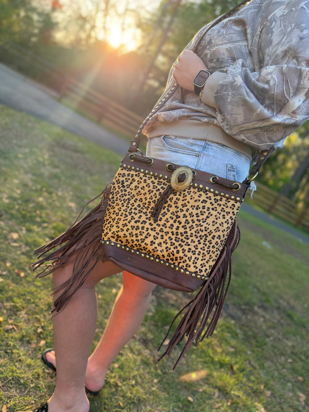 Cheetah print cowhide purse with brown fringe