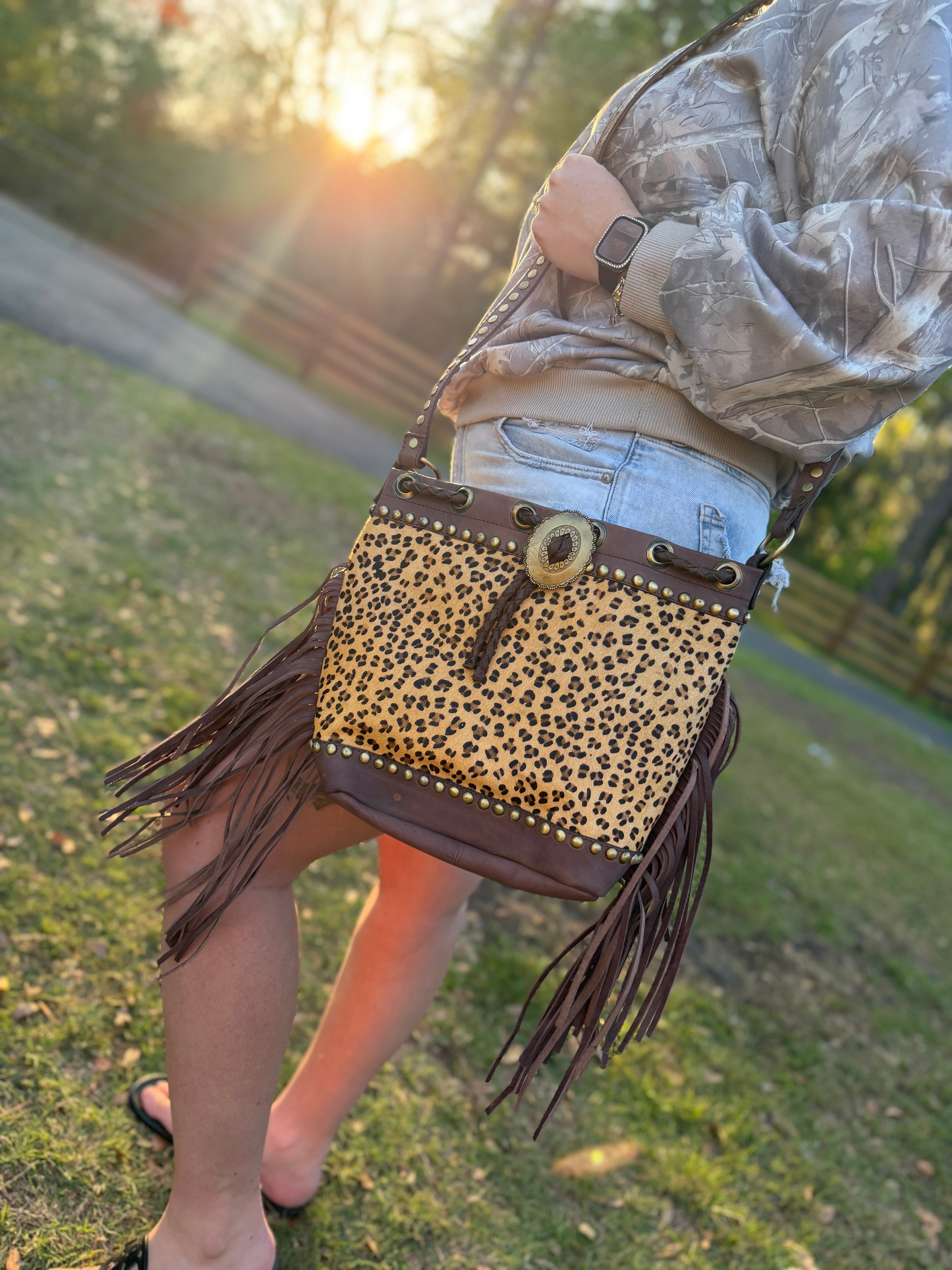 Cheetah print cowhide purse with brown fringe