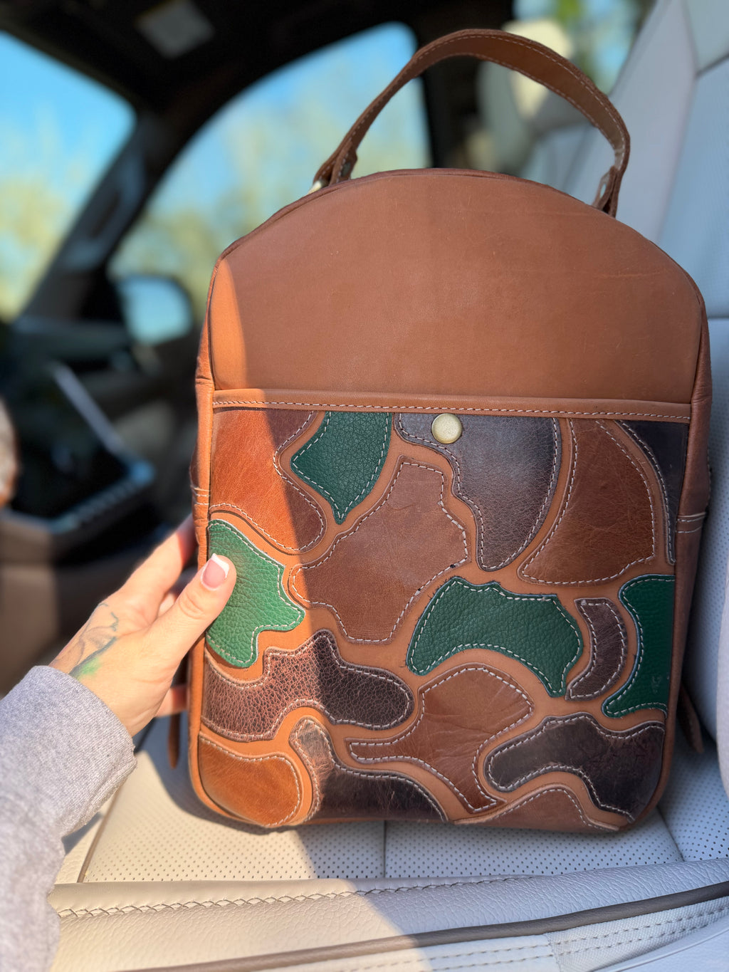 The “Hunter” camo leather bookbag by the Painted Porches
