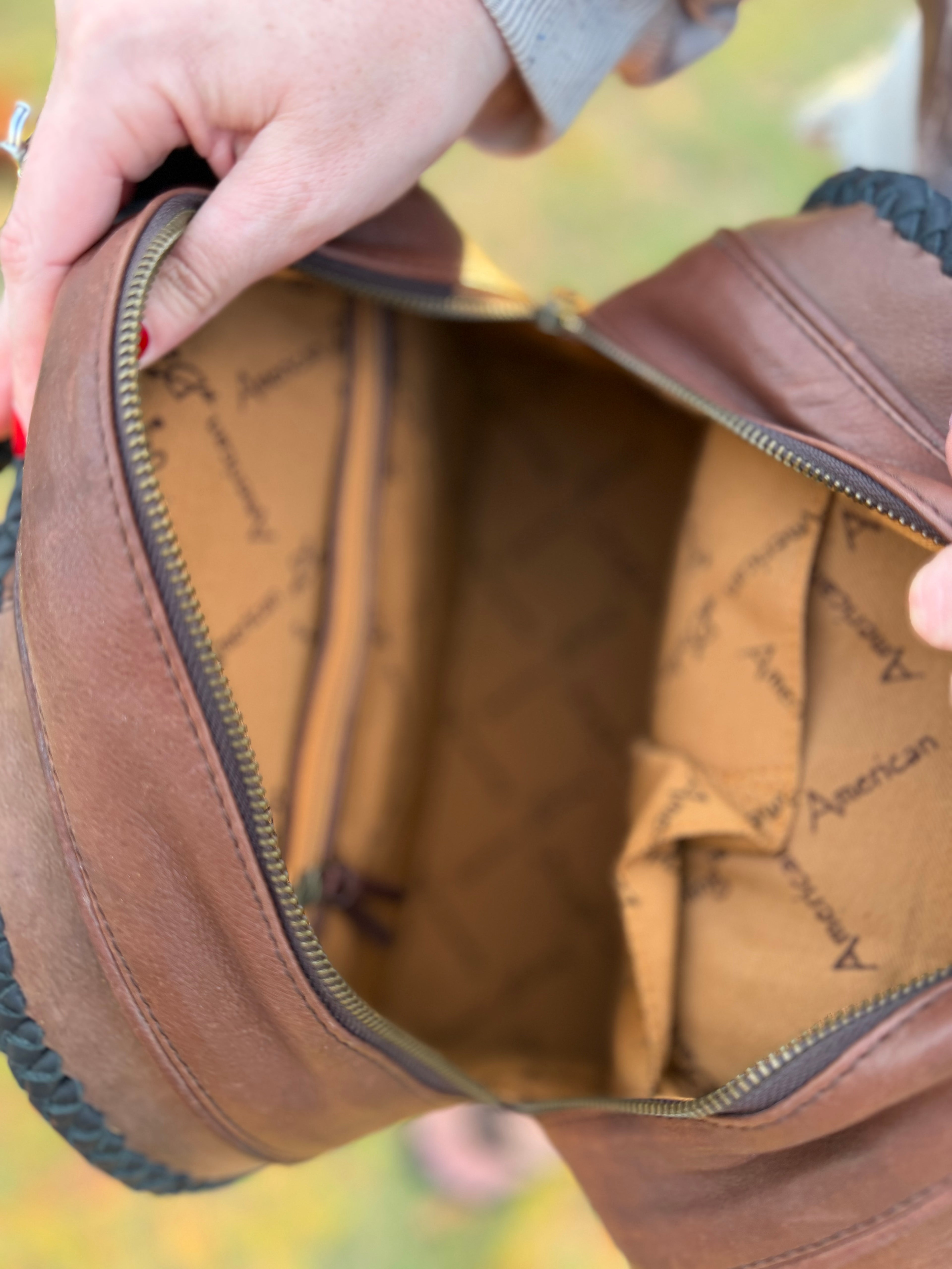 Leather purse with black fringe
