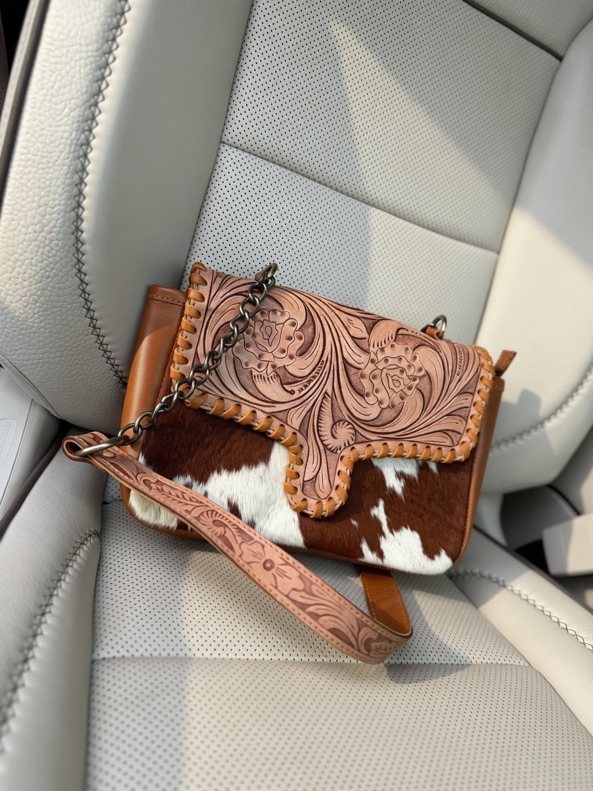 Tooled leather and cowhide crossbody bag