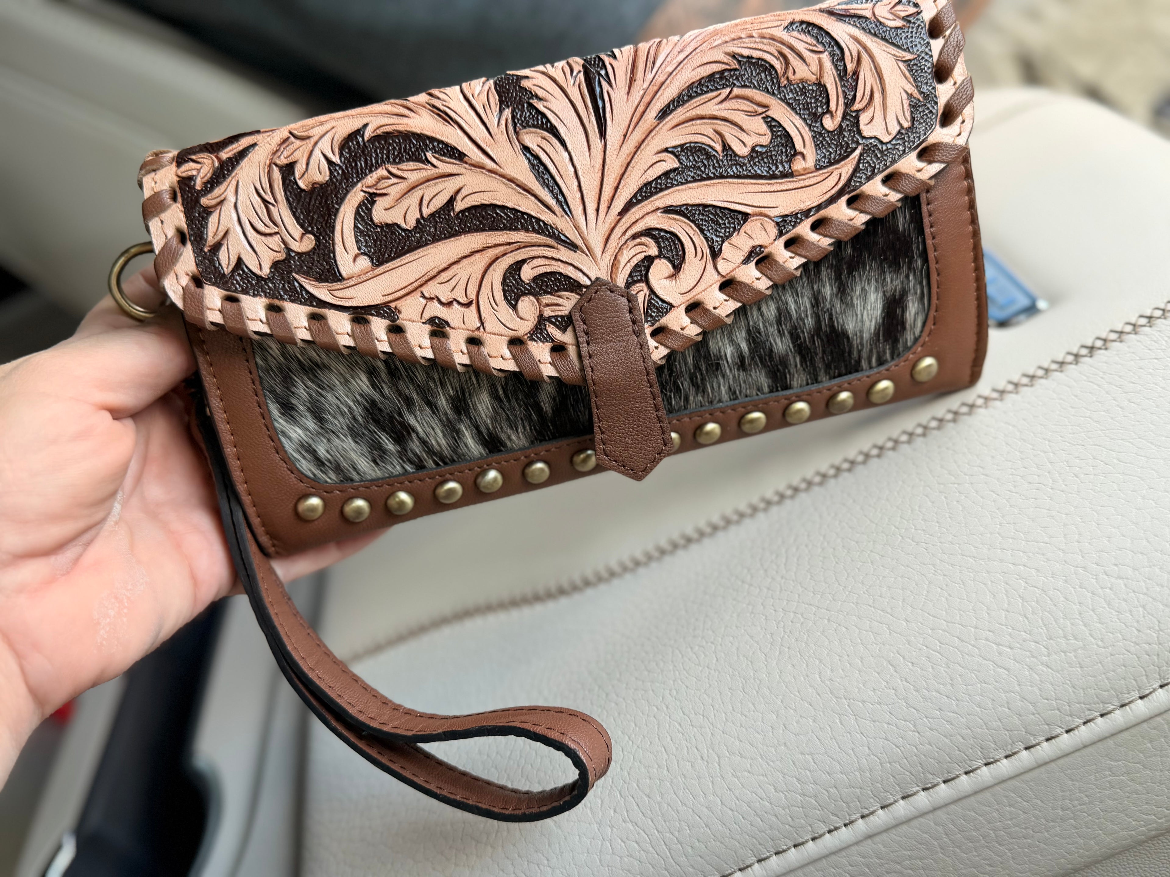 Tooled leather and cowhide wallet