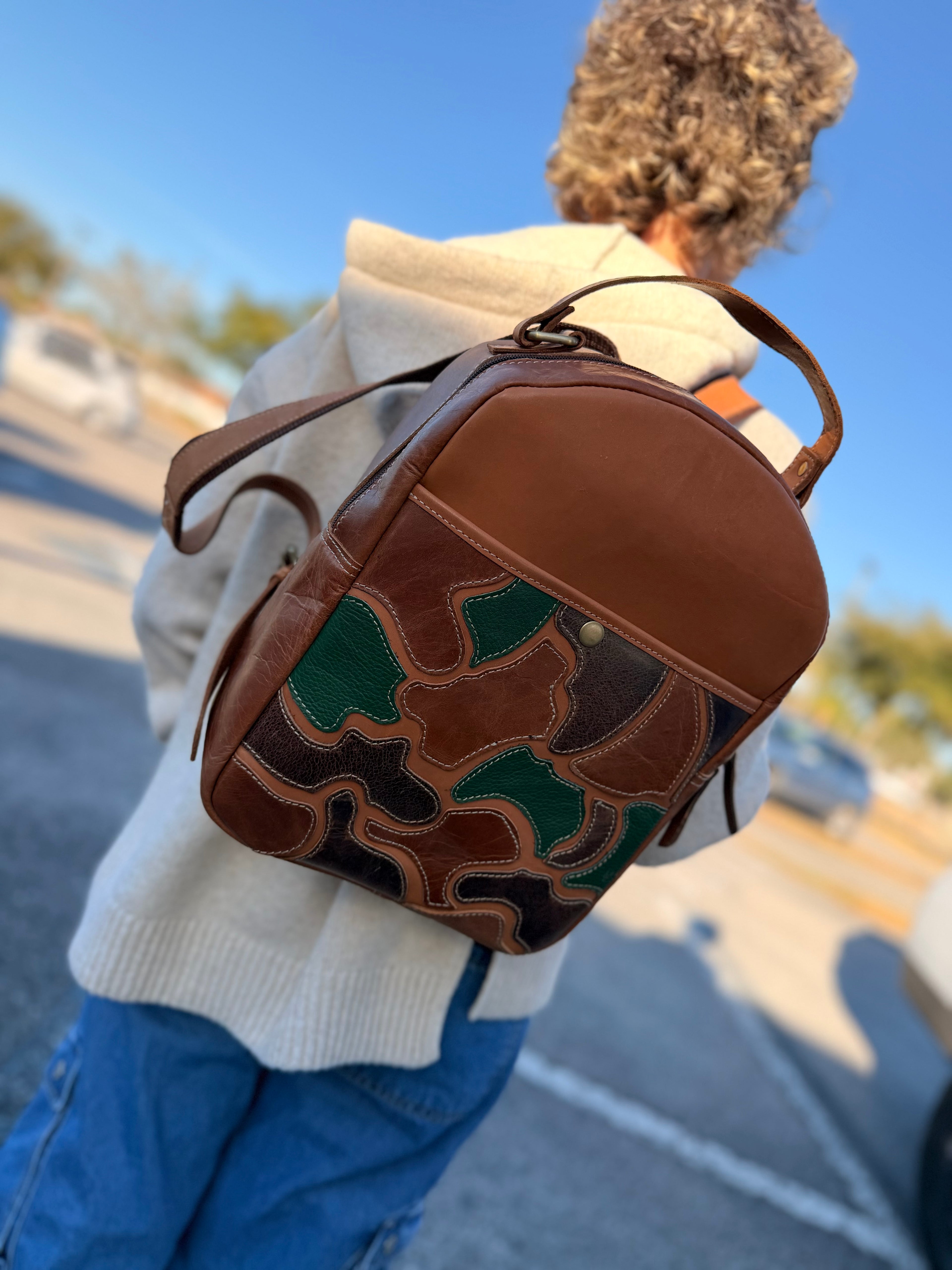 The “Hunter” camo leather bookbag by the Painted Porches